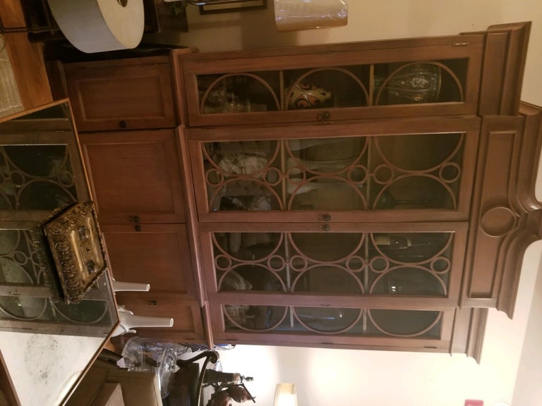 A wonderfully strong dining room breakfront/library-office bookcase that elegantly directs the fashion of a room whether it is a dining room, breakfast room or Library/ office. Measures: 79” wide by 22” deep and 109” tall (+/-). The finish is an