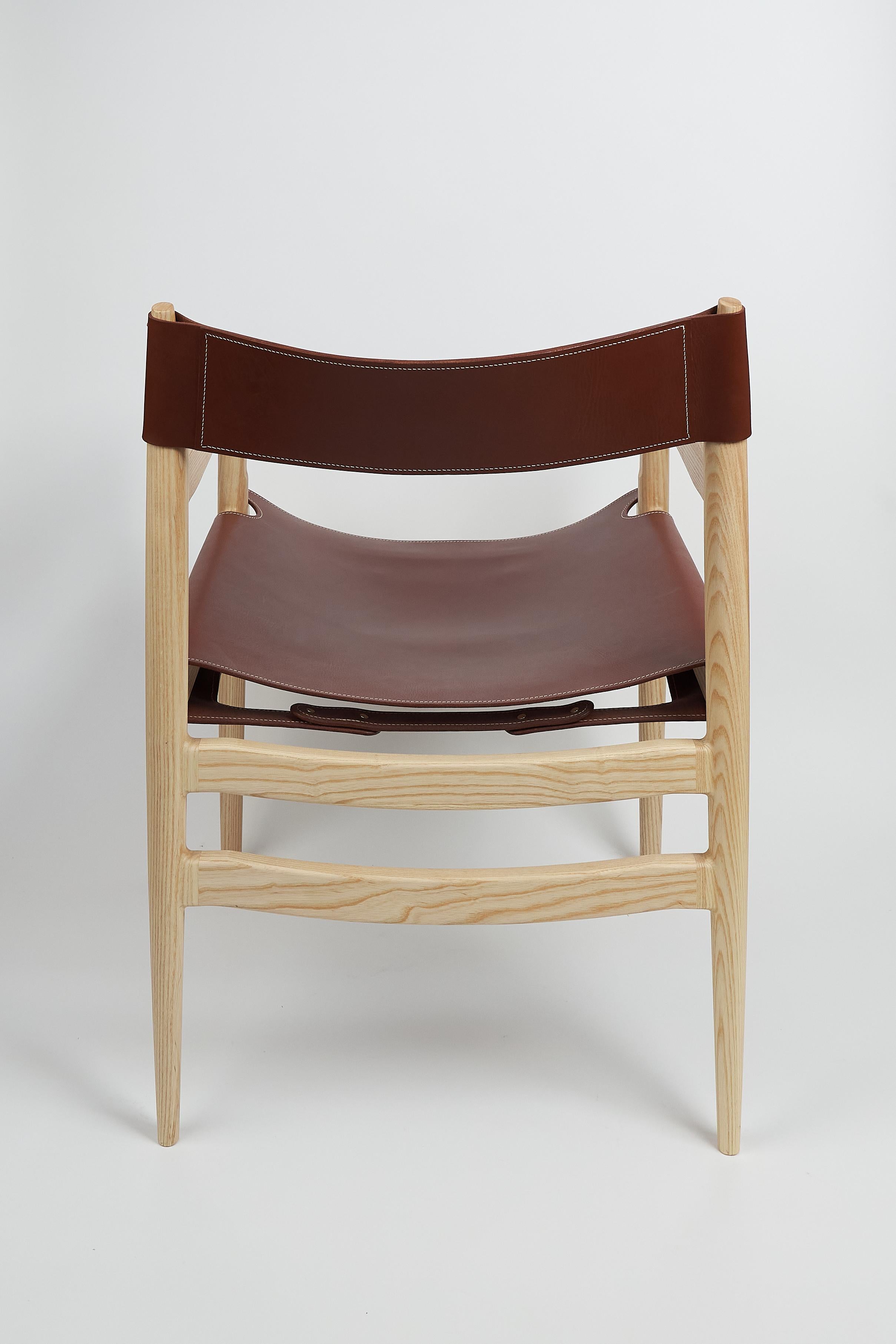 Dining room chair in ash with the sling leather seat In New Condition For Sale In Millburn, NJ