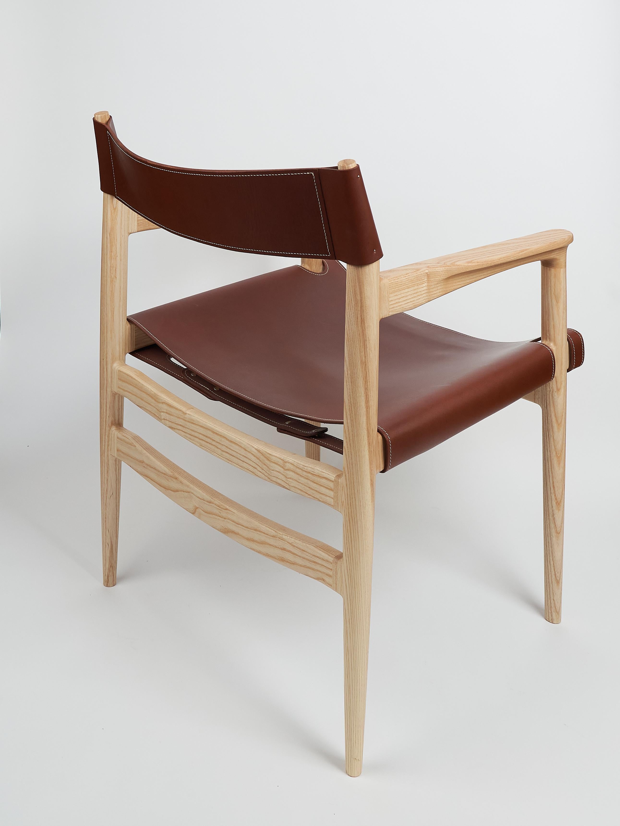 Contemporary Dining room chair in ash with the sling leather seat For Sale