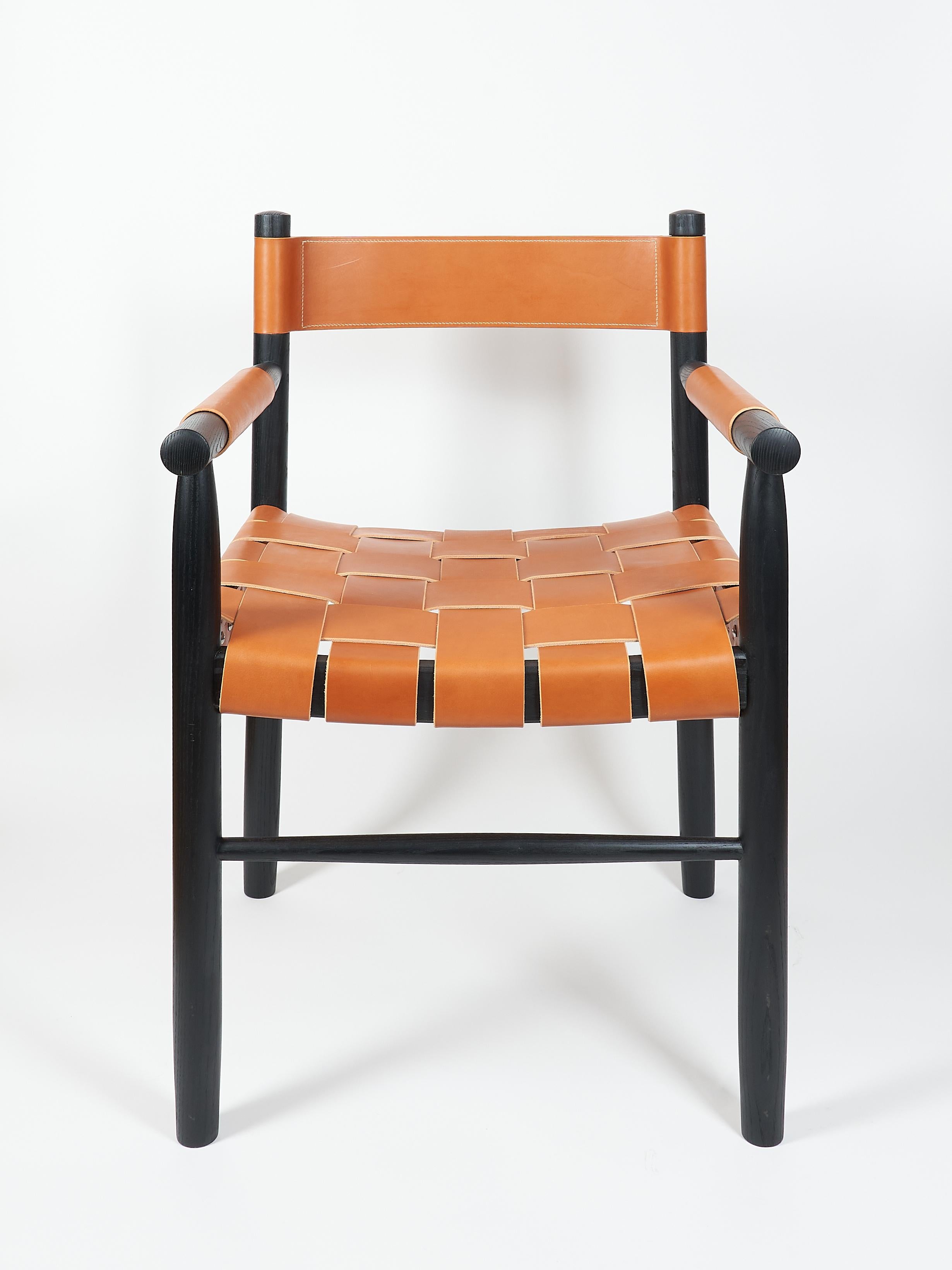 The Dining chair is made of ebonized ash with leather woven seat and leather backrest, designed and built by Valeriy Khvan.

This handcrafted dining chair blends bold materials with minimalistic design. Made from solid ash wood and finished in a