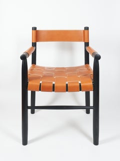 Dining room chair in ebonized ash with the woven leather seat and backrest
