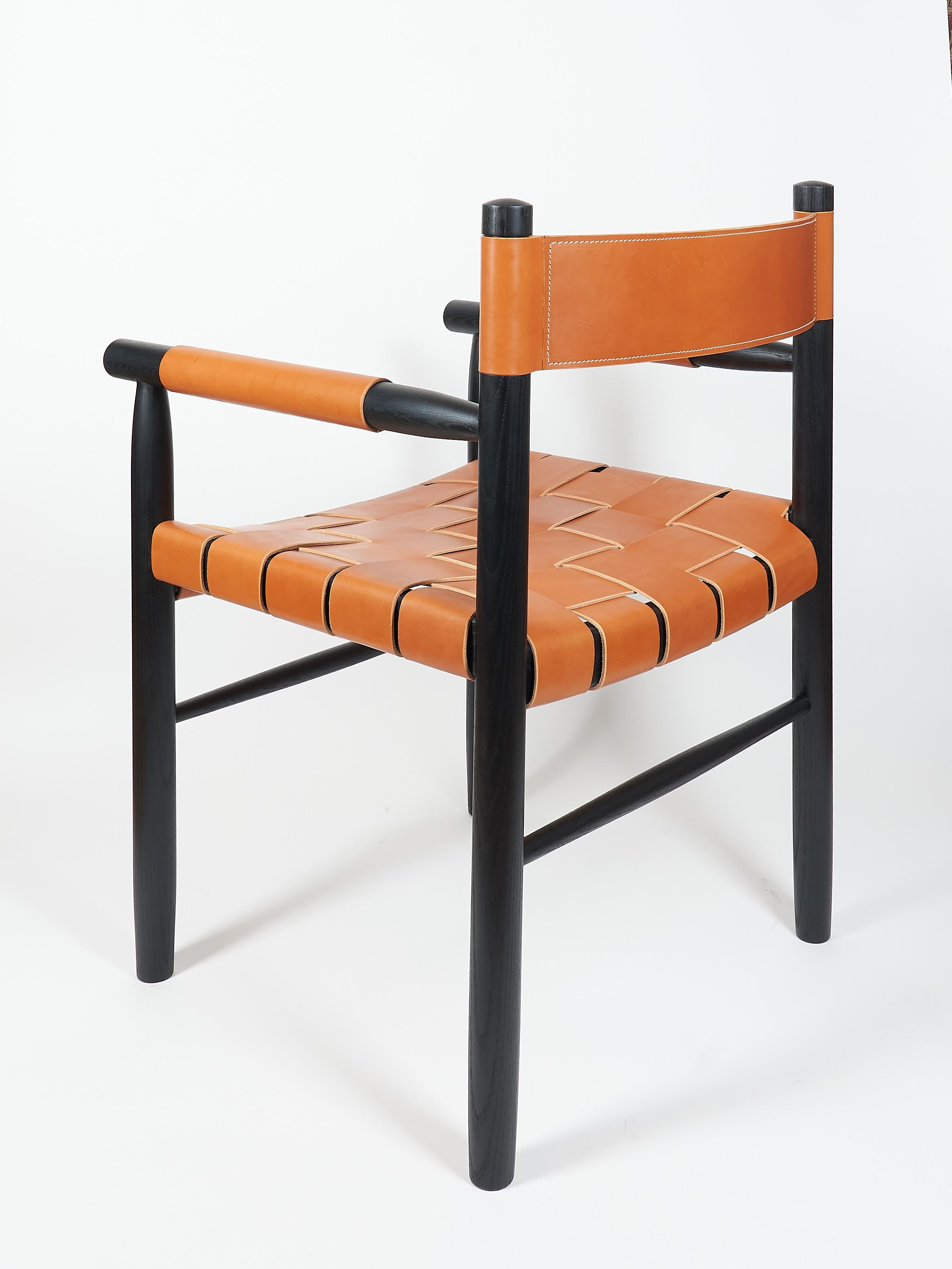 American Dining room chair in ebonized ash with the woven leather seat and backrest For Sale
