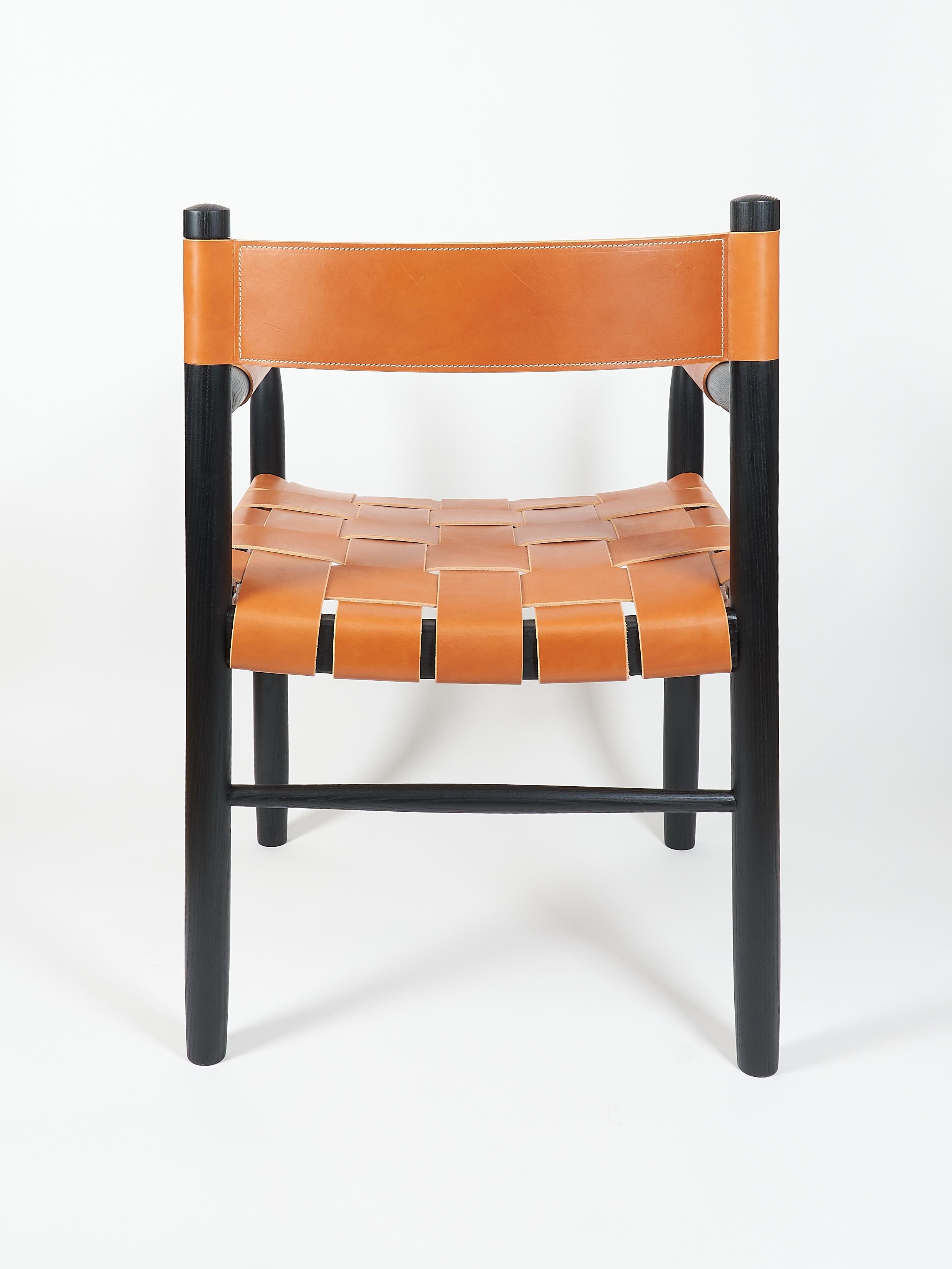 Hand-Crafted Dining room chair in ebonized ash with the woven leather seat and backrest For Sale