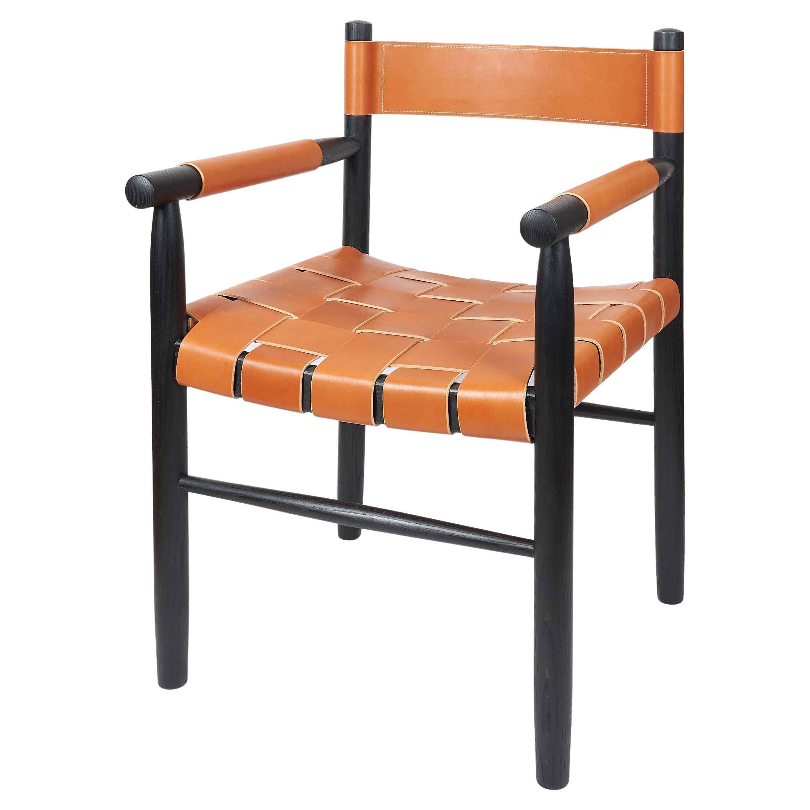 Dining room chair in ebonized ash with the woven leather seat and backrest