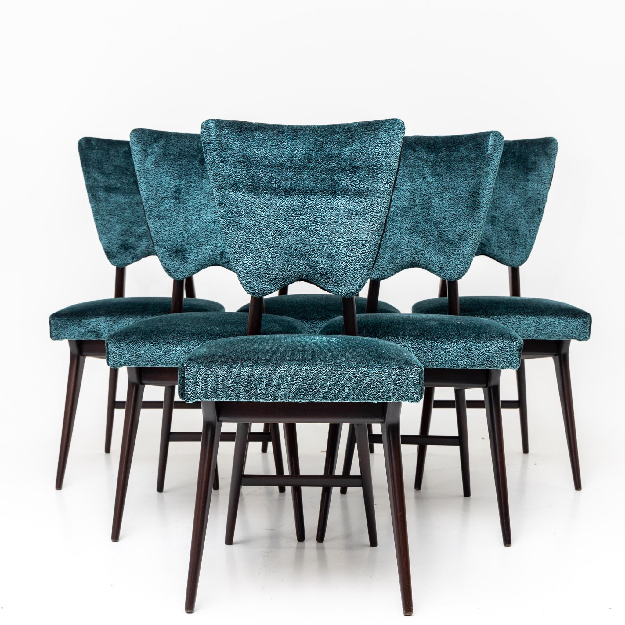 Set of six dining chairs on slender dark stained legs and trapezoidal backs. The chairs were newly upholstered in a blue and black mottled velvet fabric.