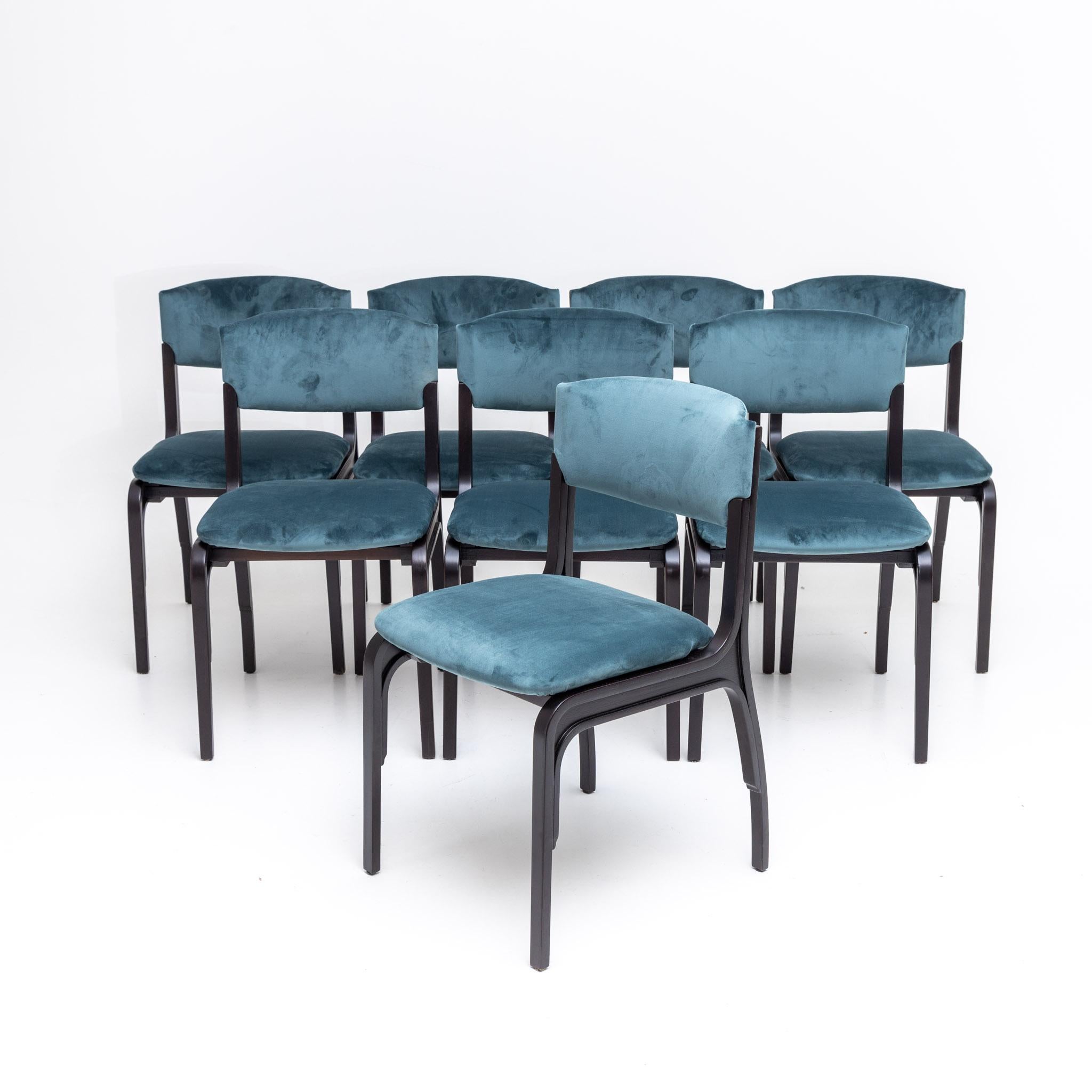 Set of eight ebonized dining chairs upholstered in blue velvet. Restored and reupholstered.