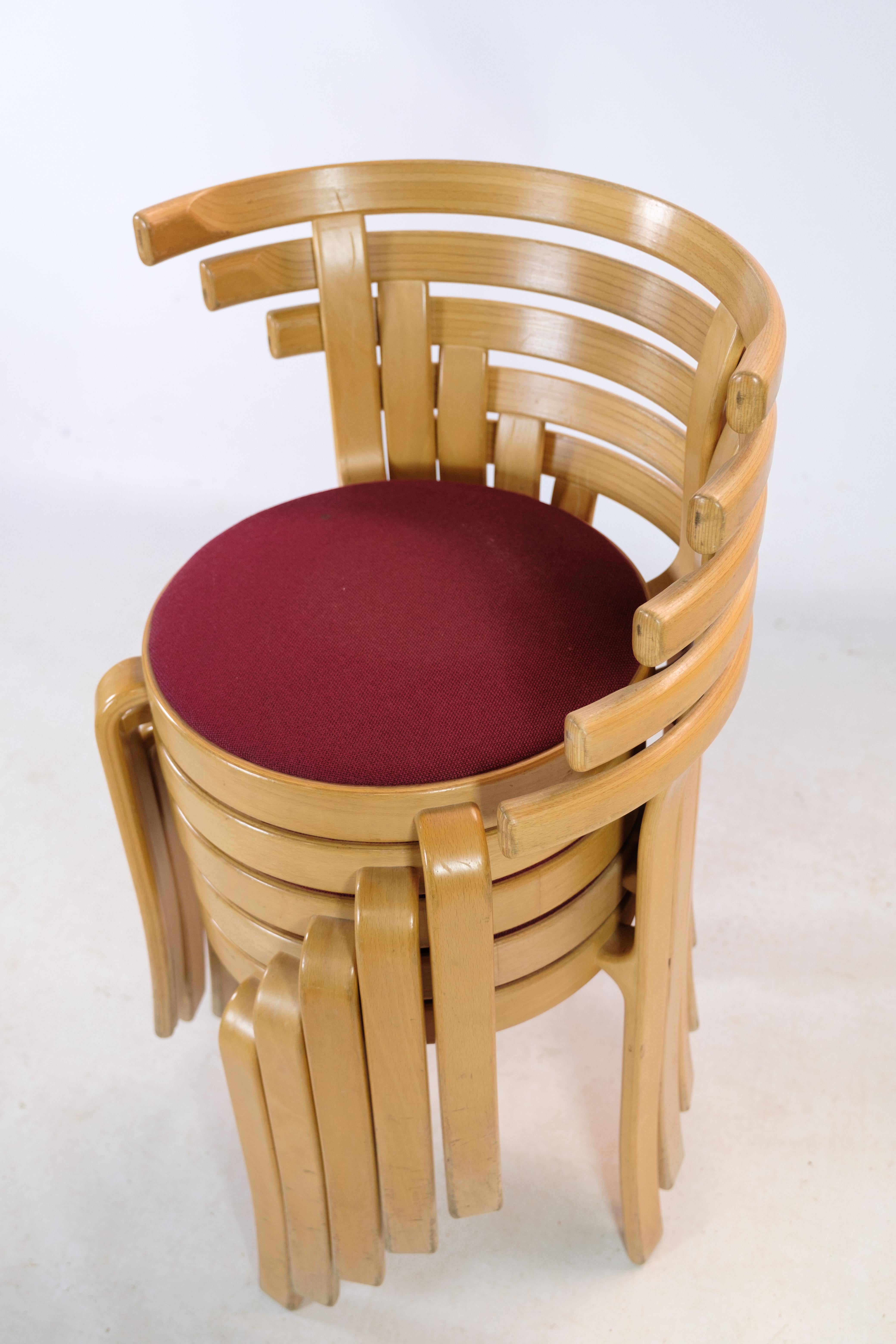 Set of 8 chairs, model 8000 Series, designed by Rud Thygesen & Johnny Sørensen in beech wood with red fabric made by Magnus Olesen. The chairs have been produced by Magnus Olesen since 1981
Measurements in cm: H:70 W:54 D:47 SH:45