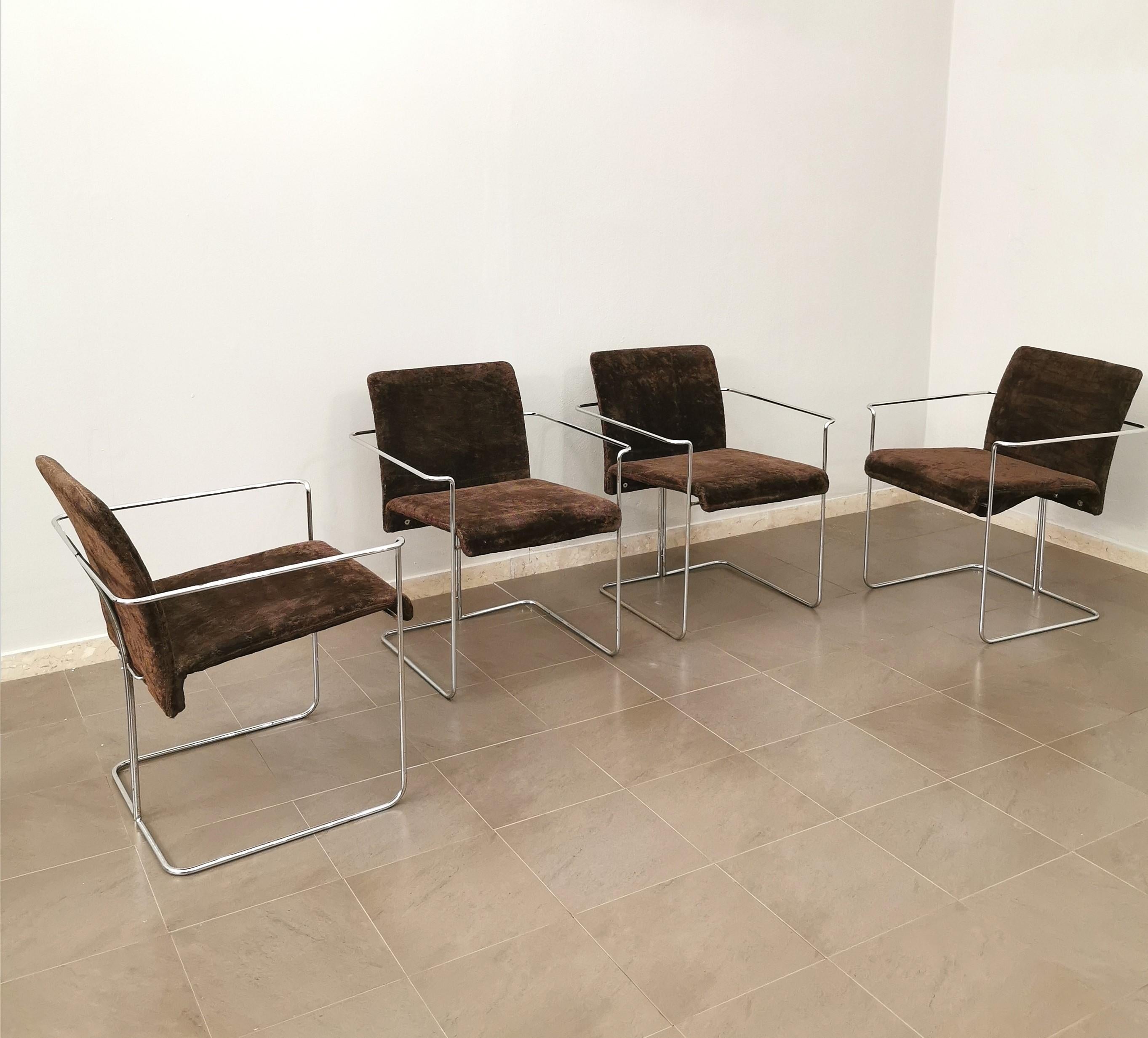 Set of 4 dining chairs produced by the Saporiti brothers in Italy in the 1970s. The chairs have a tubular chromed metal frame with curved seat and back upholstered in burnt brown smooth velvet.