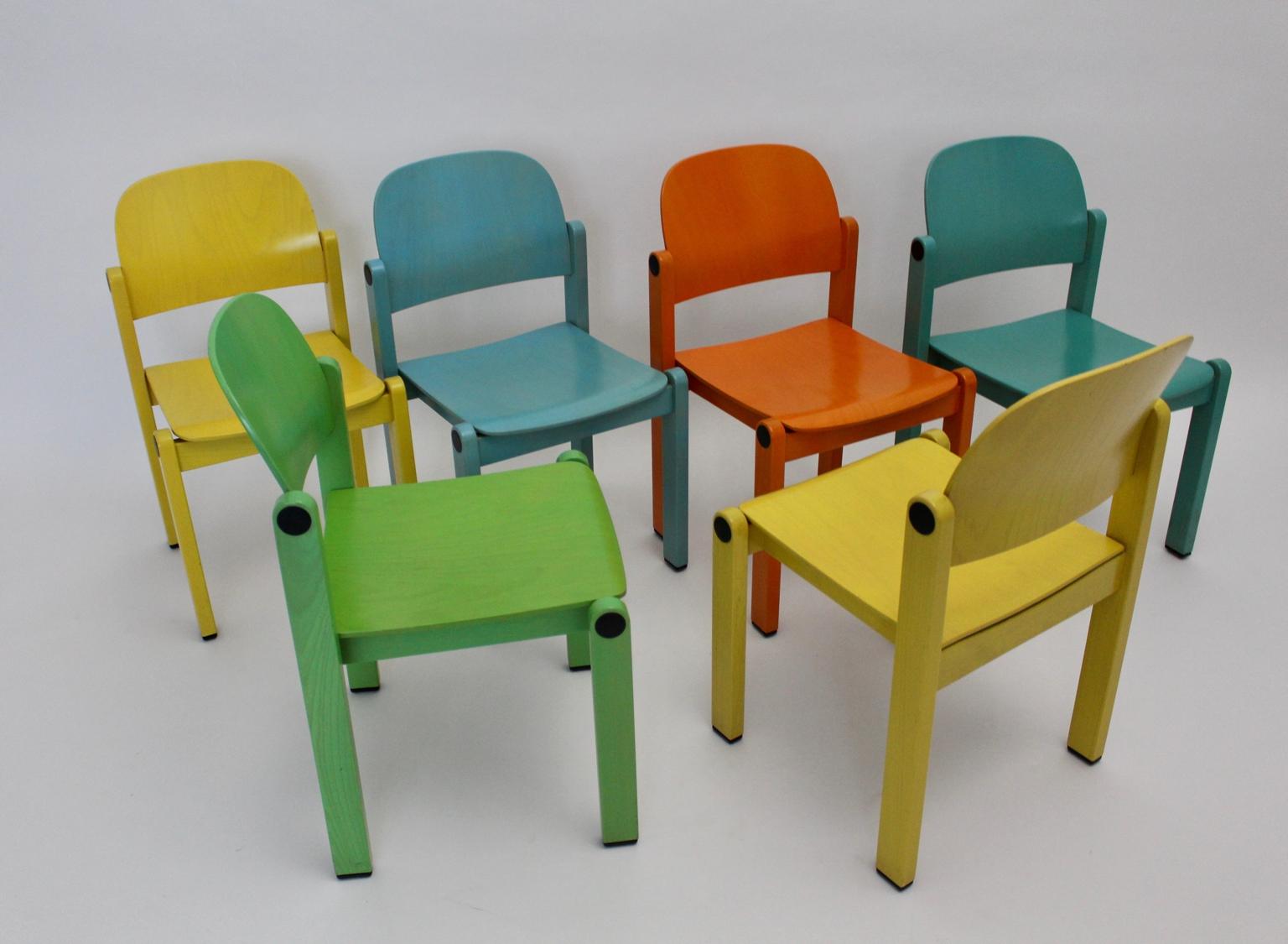 Pop Art style modern multicolored set of six vintage dining chairs from solid beechwood, 1980s. 
A stunning, splashy set six ( 6 ) stackable dining chairs from solid beech and plywood in fresh color tones.
The seat and the curved back were made of