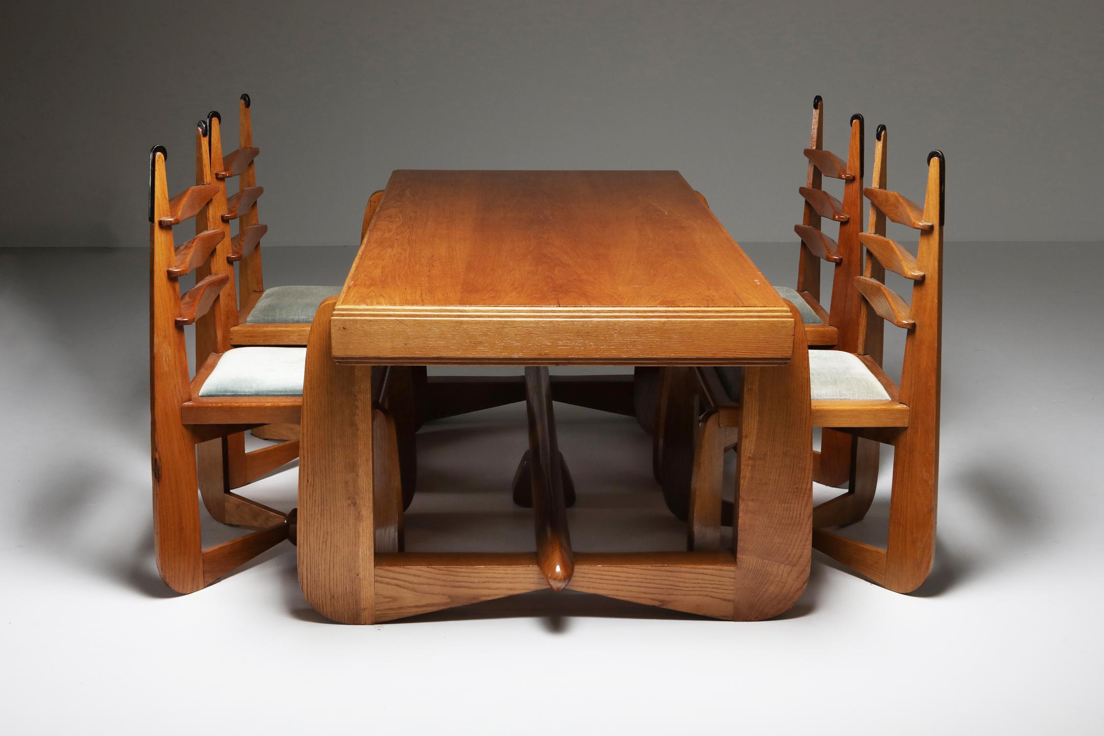 Dining room set, Amsterdamse School, Expressionist, Modern Oak

Exuberant and sculptural Amsterdamse School dining room set, created in the Netherlands in the 1930s. Dutch design, very much in the style of Kramer and Hildo Krop. Both the table and