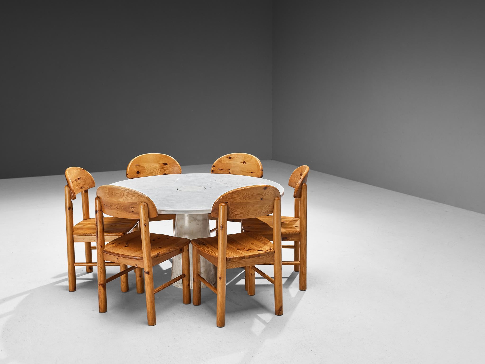 Angelo Mangiarotti for Skipper, dining table ‘Eros’, white marble, 1970s, with Rainer Daumiller Set of Six Dining Chairs in Pine

This sculptural table by Angelo Mangiarotti is a skilful example of postmodern design. The table is executed in white
