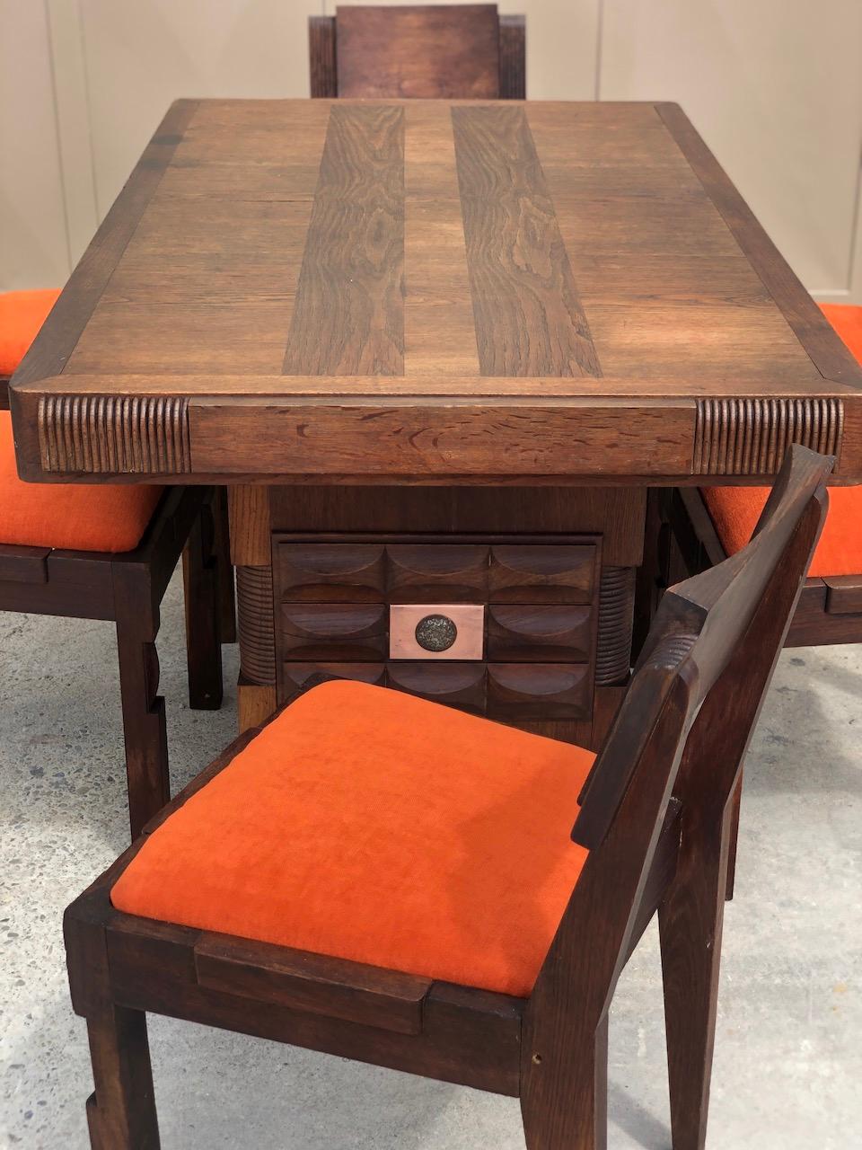 Dining room set Charles Dudouyt 1940 signed 
Table on two legs joined by a spacer decorated with cells and streaks. Tray with Italian extension system. 

Table: H: 74.5 cm - W: 144cm - D: 85 cm 

Six chairs with headbands and cakes redone with