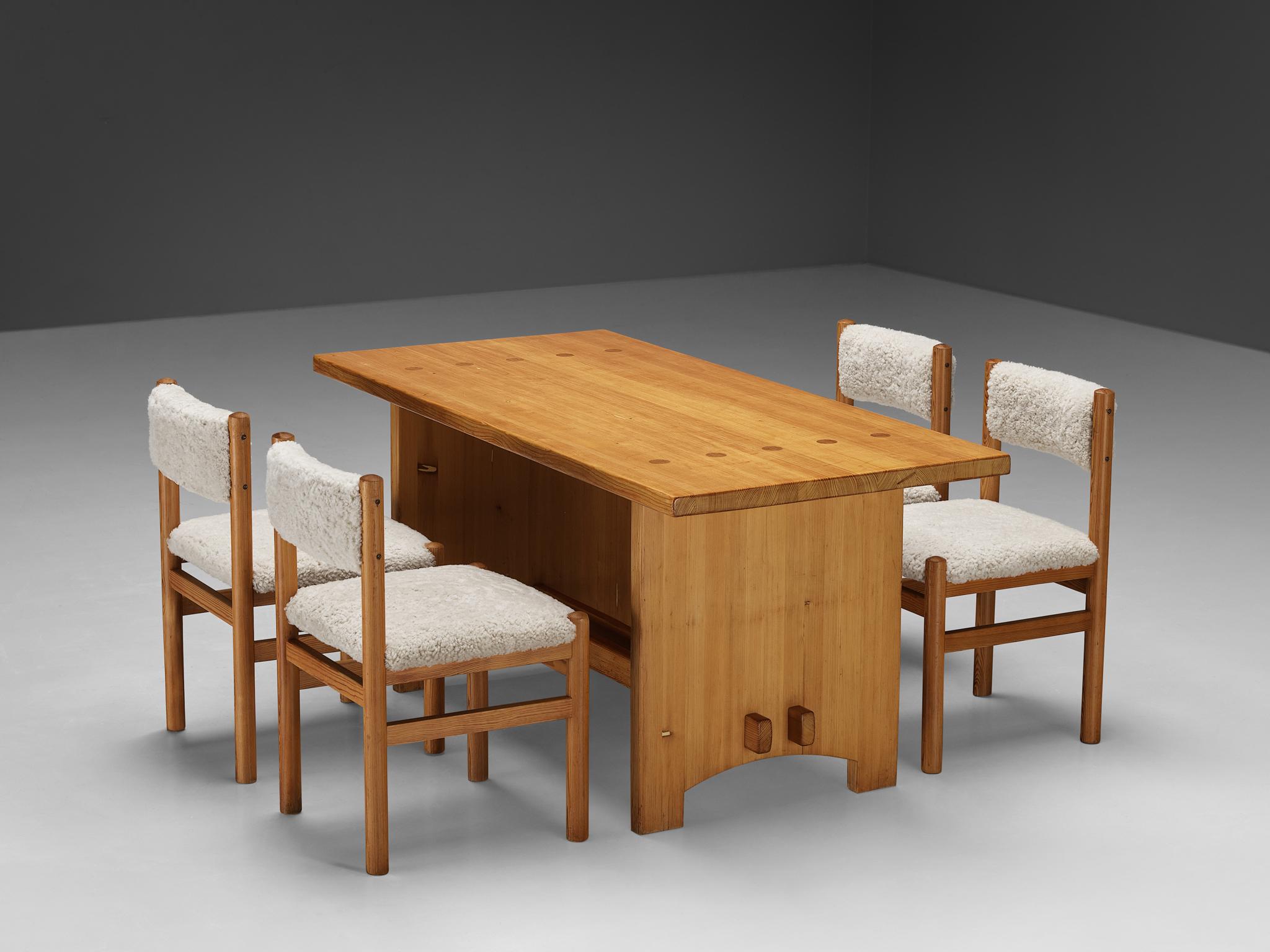 Lovely dining room set consisting of a Jacob Kielland-Brandt dining table in pine and dining chairs upholstered in sheepskin

Jacob Kielland-Brandt, dining table, solid pine, Denmark, 1960s.

This remarkable table holds a natural expression due to