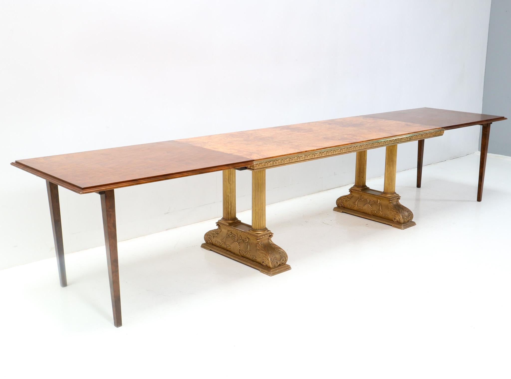 Magnificent and rare  Ceasar dining room table.
Design by Axel Einar Hjorth for NK Nordiska Kompaniet.
Striking Swedish design from the 1920s.
Original gilt birch base with hand-carved decoration.
The top is original veneered with burl walnut