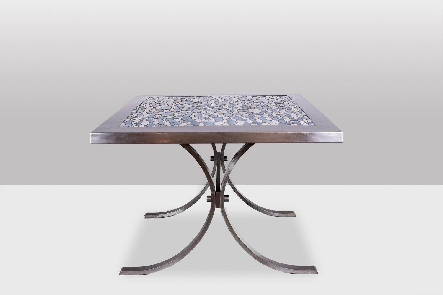Dining room table in polished metal and ceramic with abstract blue and white decoration, rectangular in shape, the top resting on two curved legs.

French work realized in the 1970s.

Dimensions: H 74 x W 218 x D 48 cm

Reference: LS60113208H