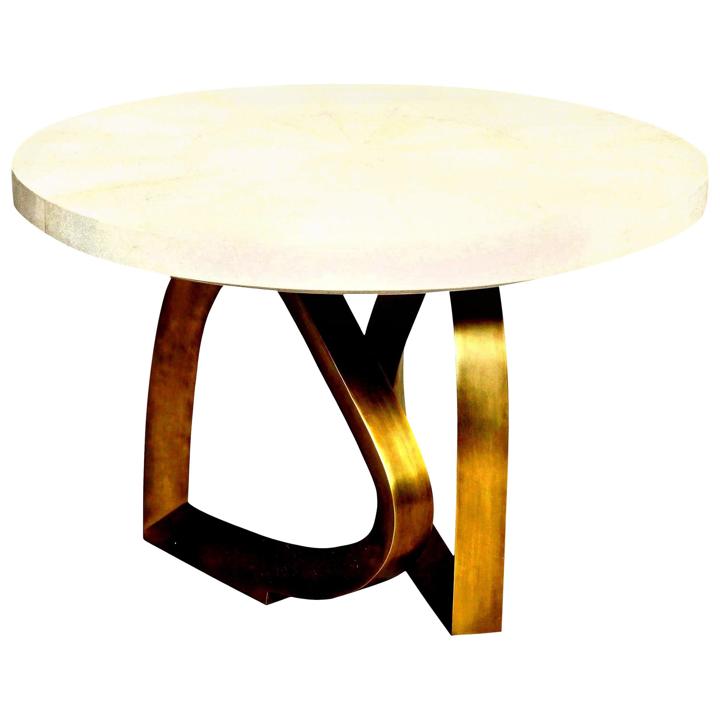Decorative shagreen cream dining table with an organic shaped brass base, designed in France. Breakfast table/ dining room table.
We have the shagreen table in stock.
The top is beautifully made of shagreen. The organic shaped brass base looks