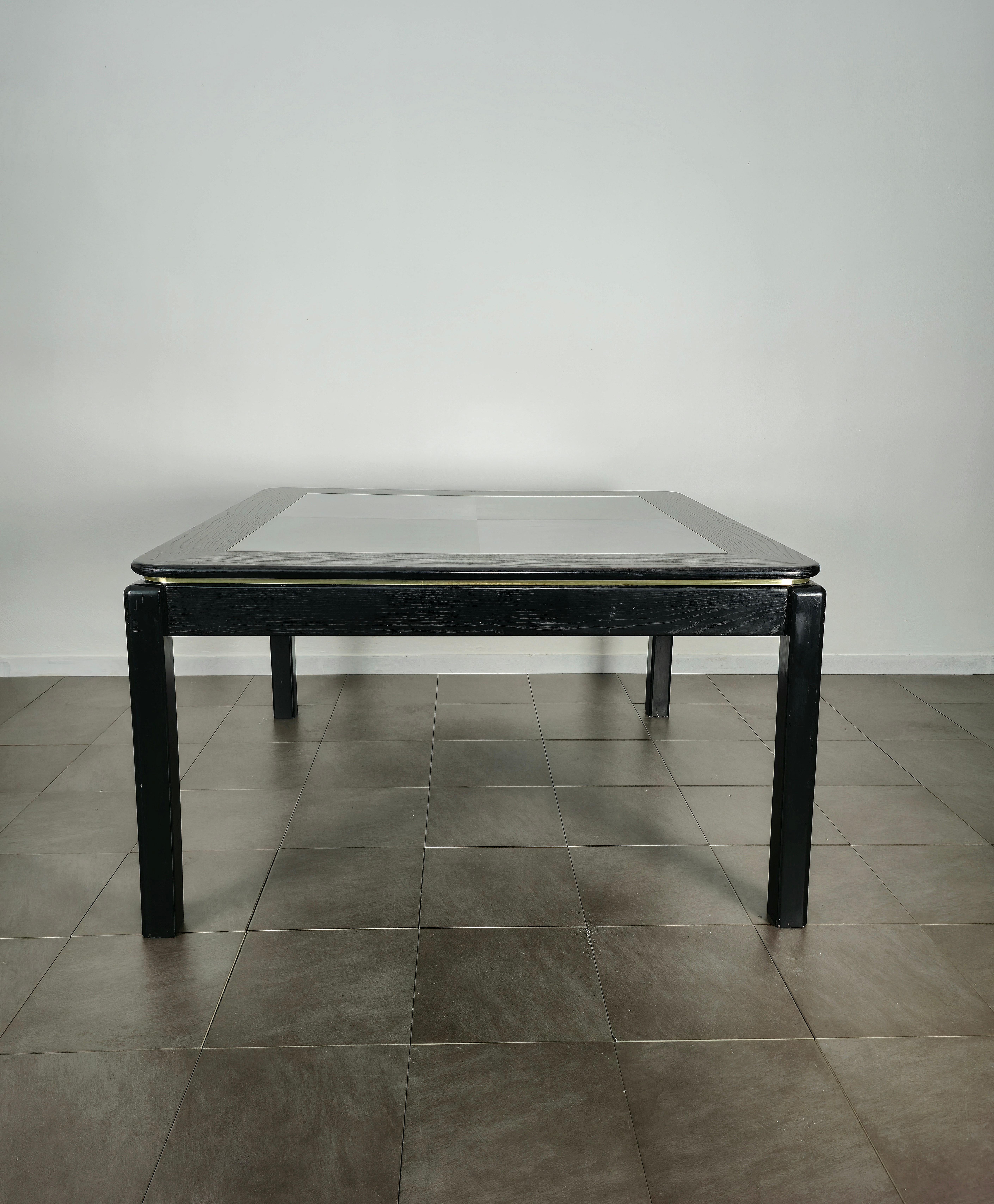 Large dining table produced in Italy in the 1970s.
The 4-legged table was made of black enamelled wood with a square-shaped top with 4 panels in anodized aluminum.



Note: We try to offer our customers an excellent service even in shipments all
