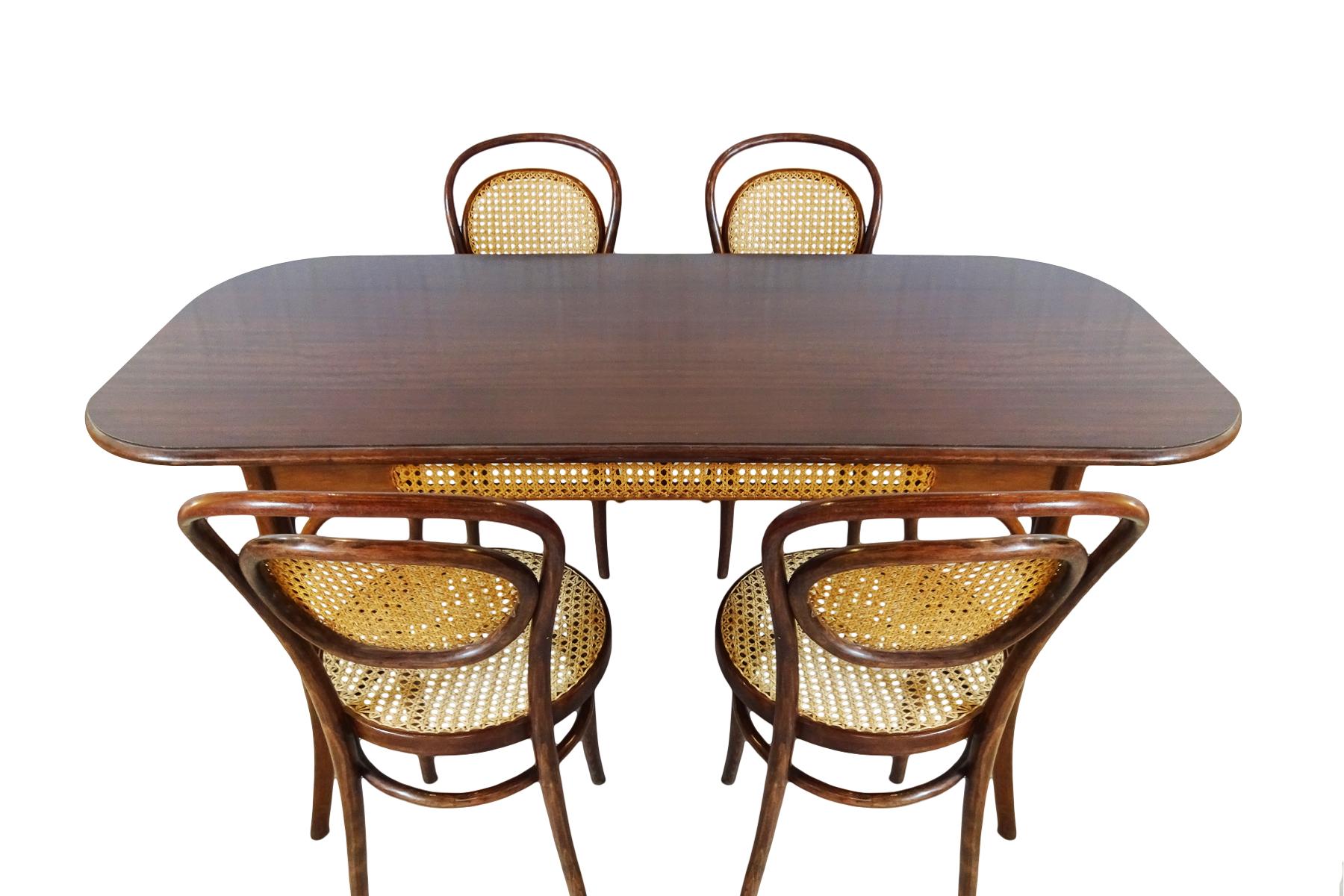 An excellent antique dining set comprising 4 x Michael Thonet designed No. 11 bergère chairs with a matching bergère sided table, circa 1910-1914

It’s very rare to find 4 matching antique Thonet designed chairs with the bergère backs alongside a