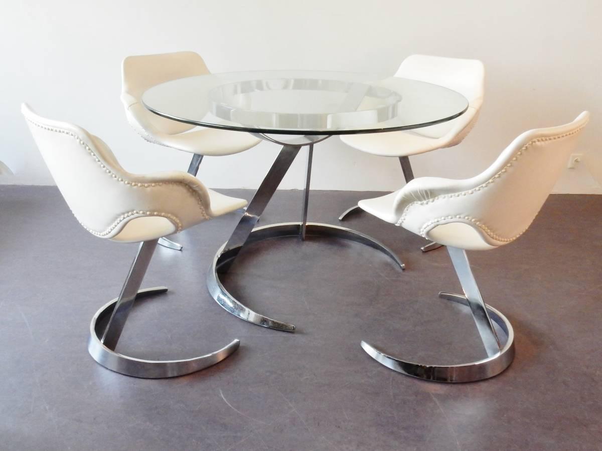 This dining set is a fully original set that attributed to Boris Tabacoff for 'Mobilier Modulaire Moderne' (MMM) from France. 
Boris Tabacoff, a French designer of Bulgarian origin. His designs distinguish themselves by their shape. Often a broken
