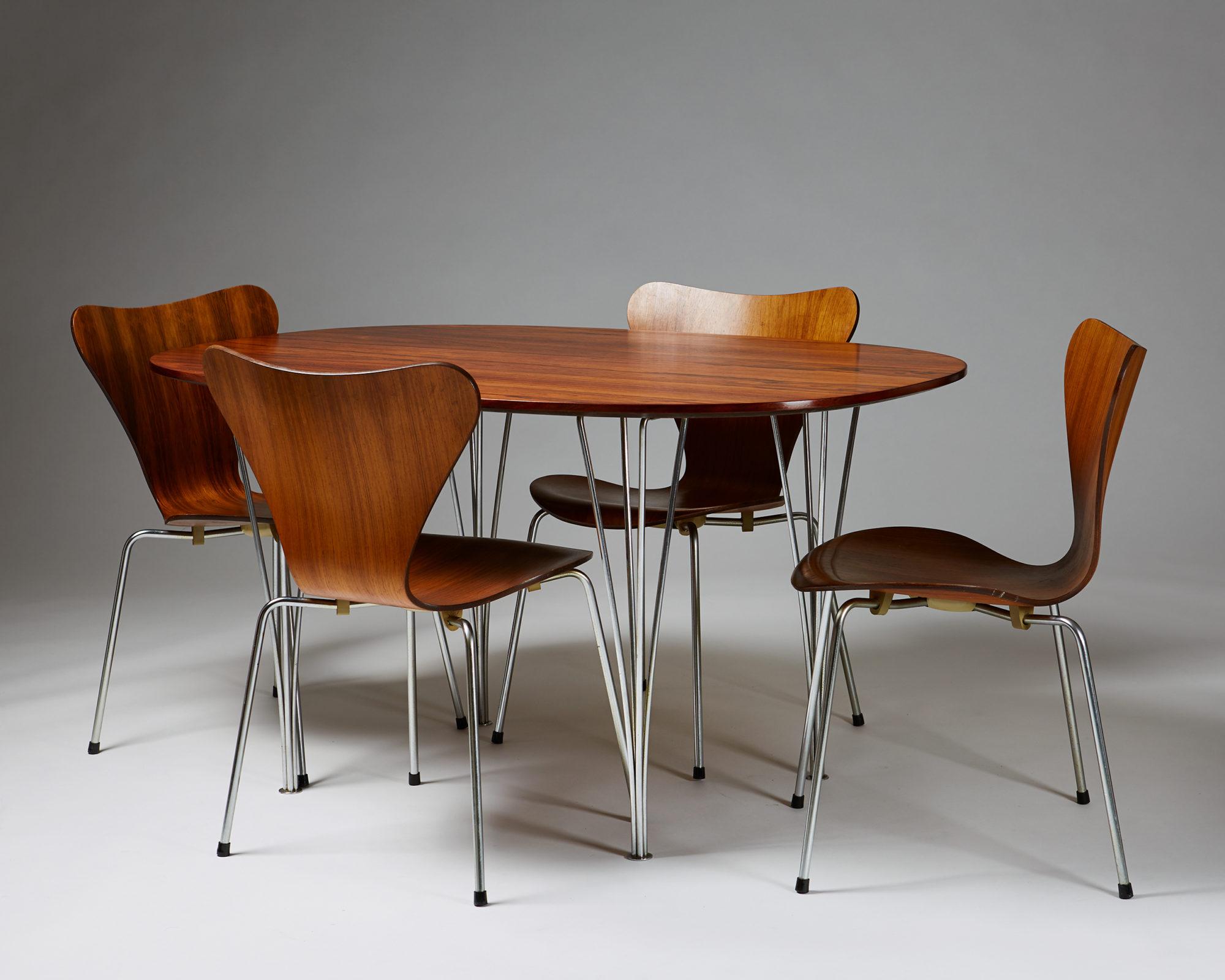 Dining set designed by Bruno Mathsson, Piet Hein and Arne Jacobsen for Fritz Hansen,
Denmark, 1950-1960s.

Rosewood and steel.

Table:
H: 70 cm / 2' 4''
L: 135 cm / 4' 5 1/2''
W: 90cm / 3'

Chairs:
H: 76 cm / 2' 6 1/4''
SH: 43 cm / 1' 4