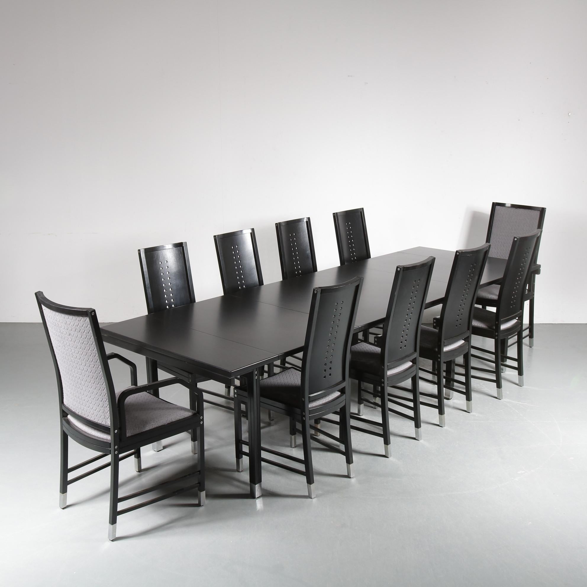 An impressive set of ten dining chairs with extendible dining table, designed by Ernst W. Beranek and manufactured by Thonet in Austria around 1980.

This eye-catching set is made of high quality black wood. The table and chairs all have chrome