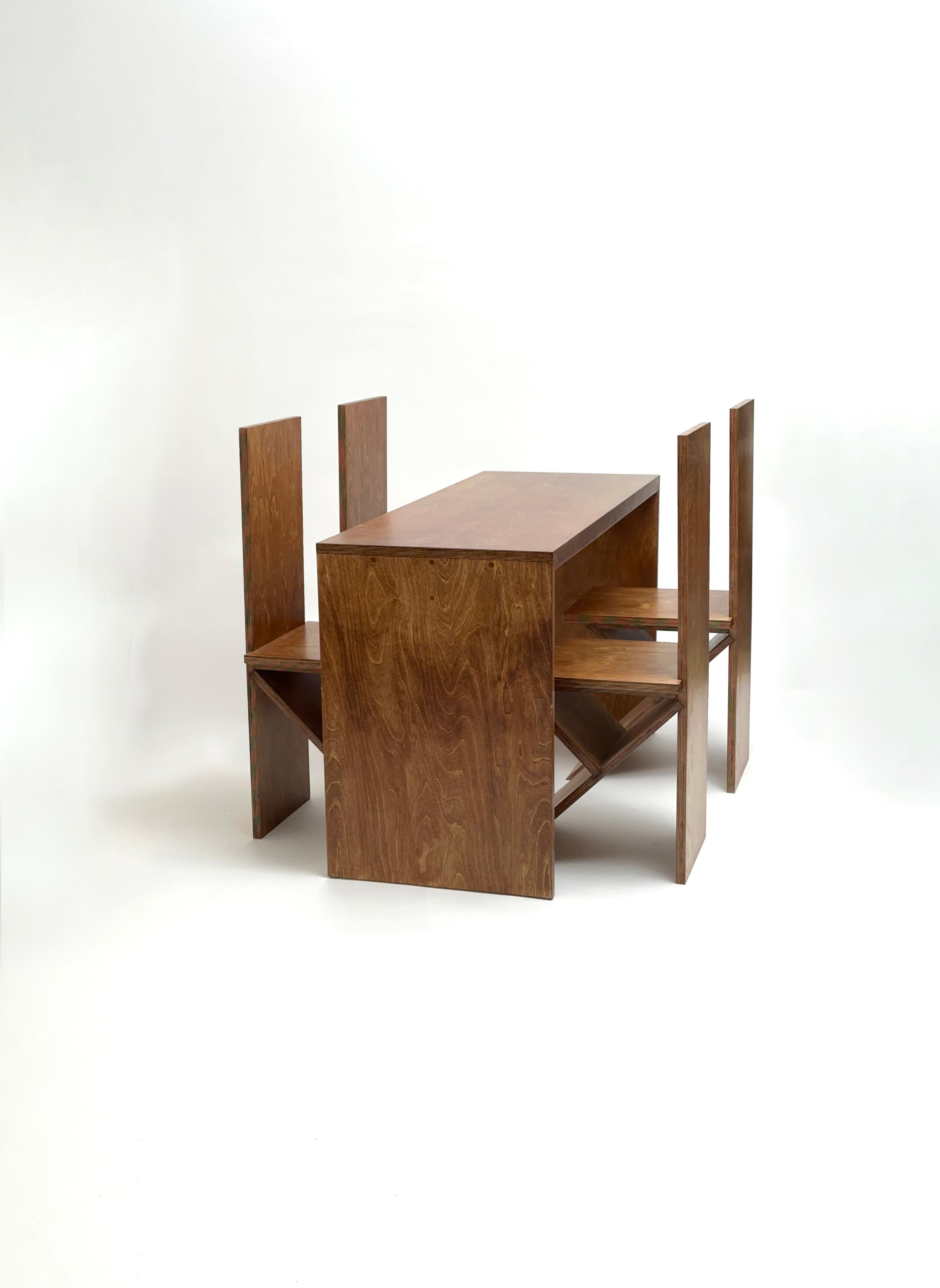 Dining Set by Goons
Dimensions:  
Table: W 130 x D 50 x  H 74 cm
Chair: 35 x 40 x 95 cm
Materials: Wood.

Goons is located in Paris, France. All of their designs are made out of wood.