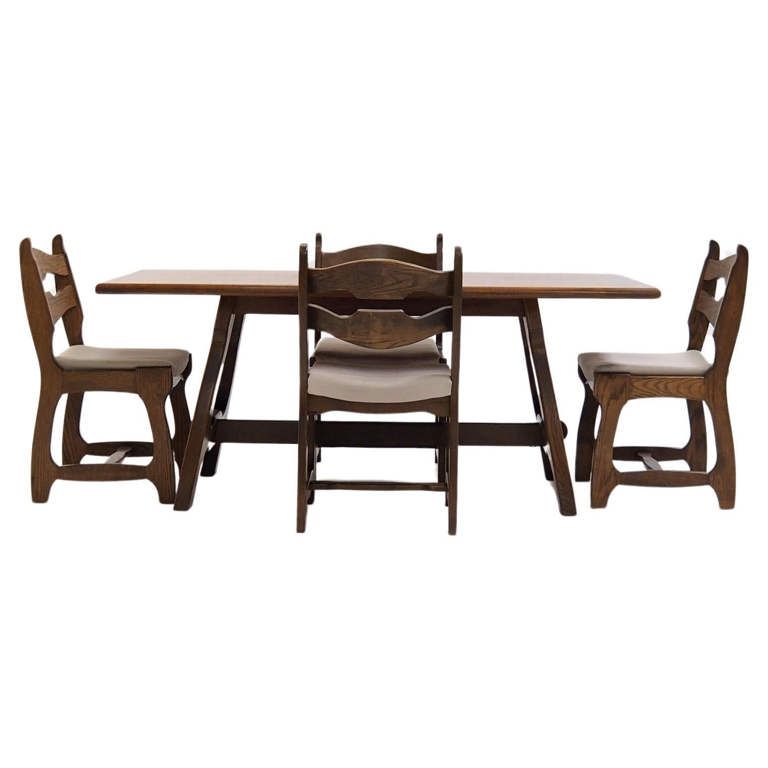 Rare dining set by Robert Guillerme and Jacques Chambron.

The set was designed in the 1950s and manufactured by the French manufacturer “Votre Maison”. It is made entirely of solid oak and is still in vèry good condition. Very sturdy too. Maybe the