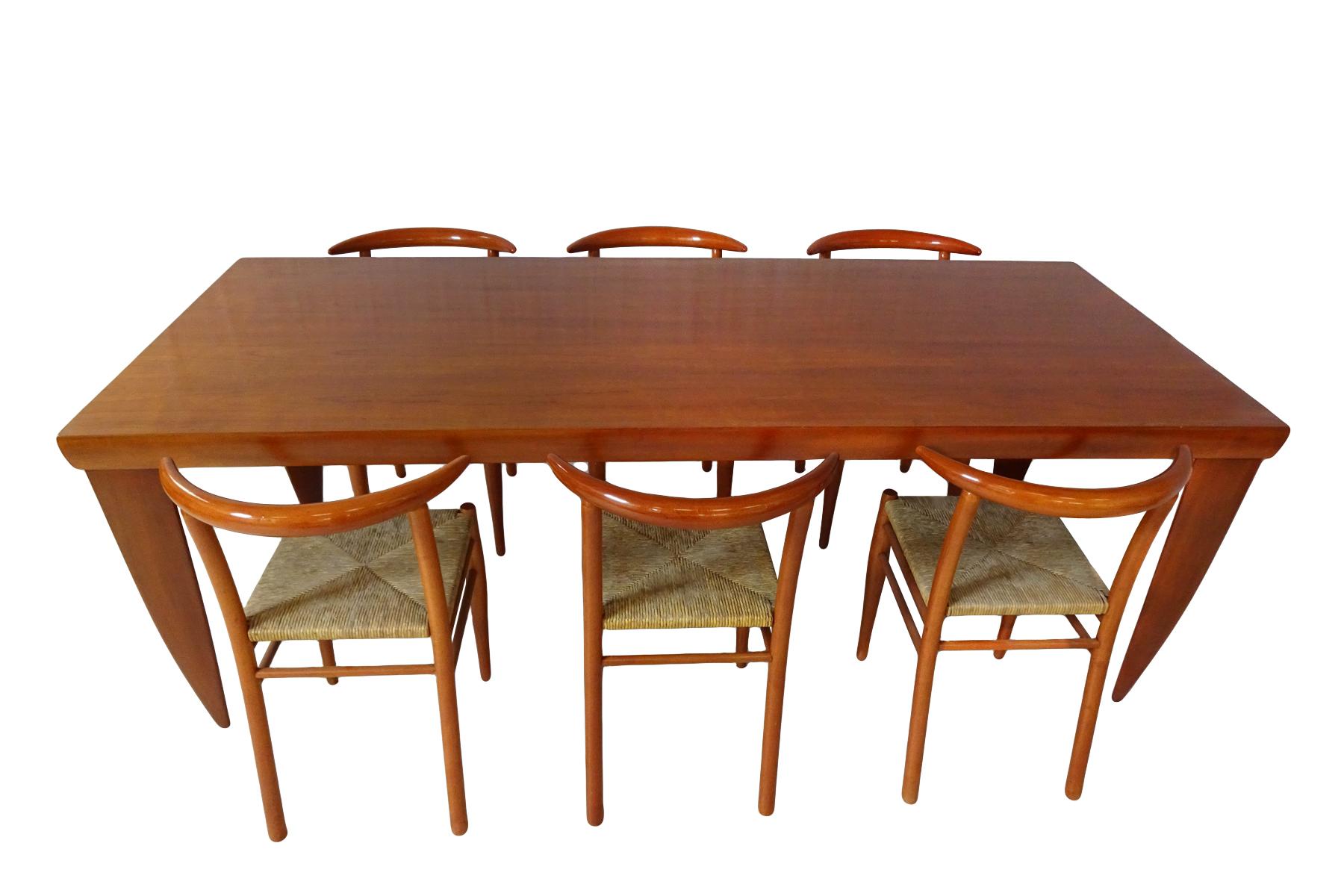 An impressive and substantial dining set incorporating a large solid cherrywood dining table matched with 6 Philippe Starck cherrywood Tessa nature chairs.

Although they are by separate design teams this dining set is an excellent match. Both in
