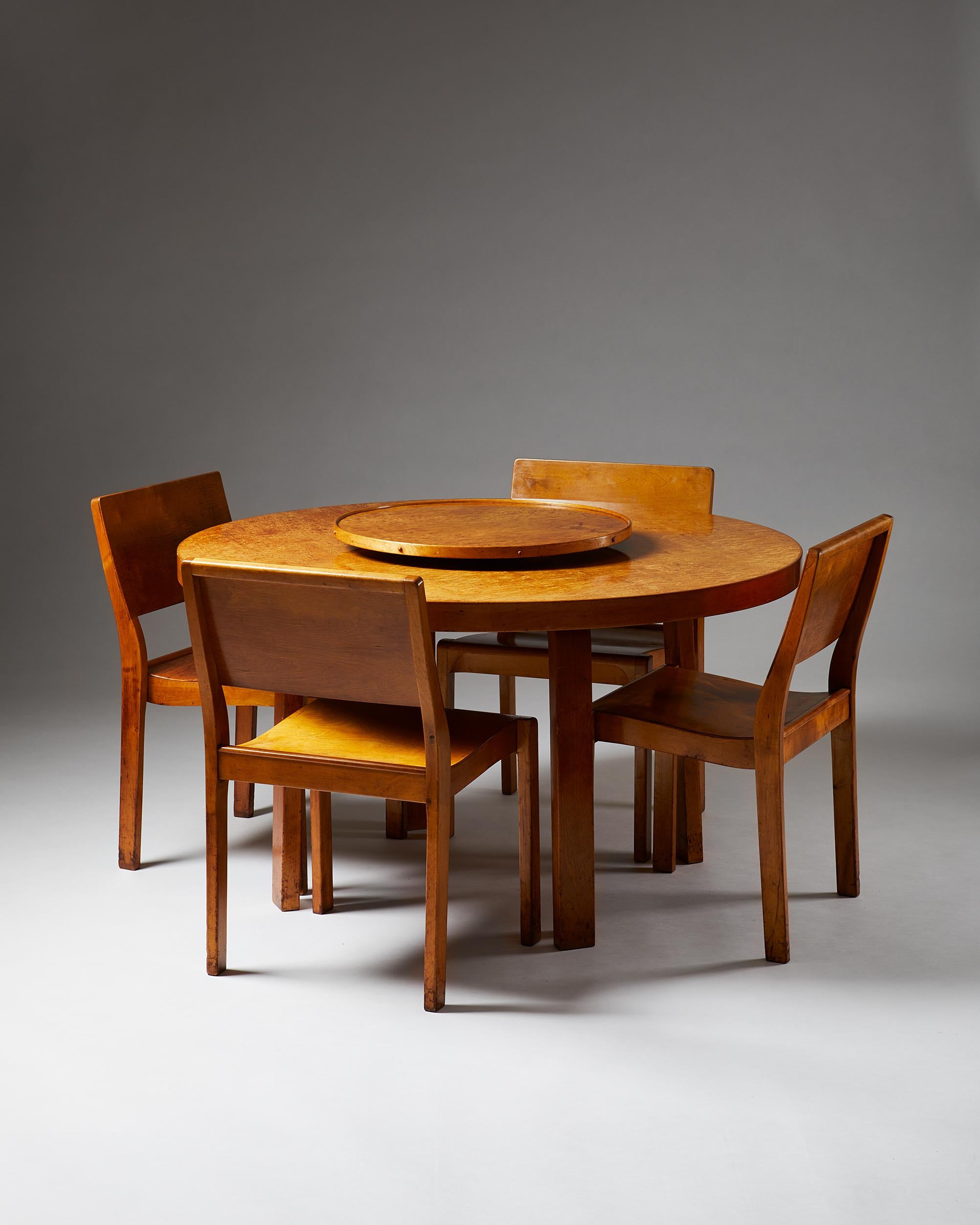 Dining set designed by Alvar Aalto for Finmar Ltd.,
Finland, 1929-1935.
The set consists of a table 91 and four 611 stacking chairs.

The tabletop and Lazy Susan veneered in Karelian birch. The chairs in birch.

All pieces with Finmar's