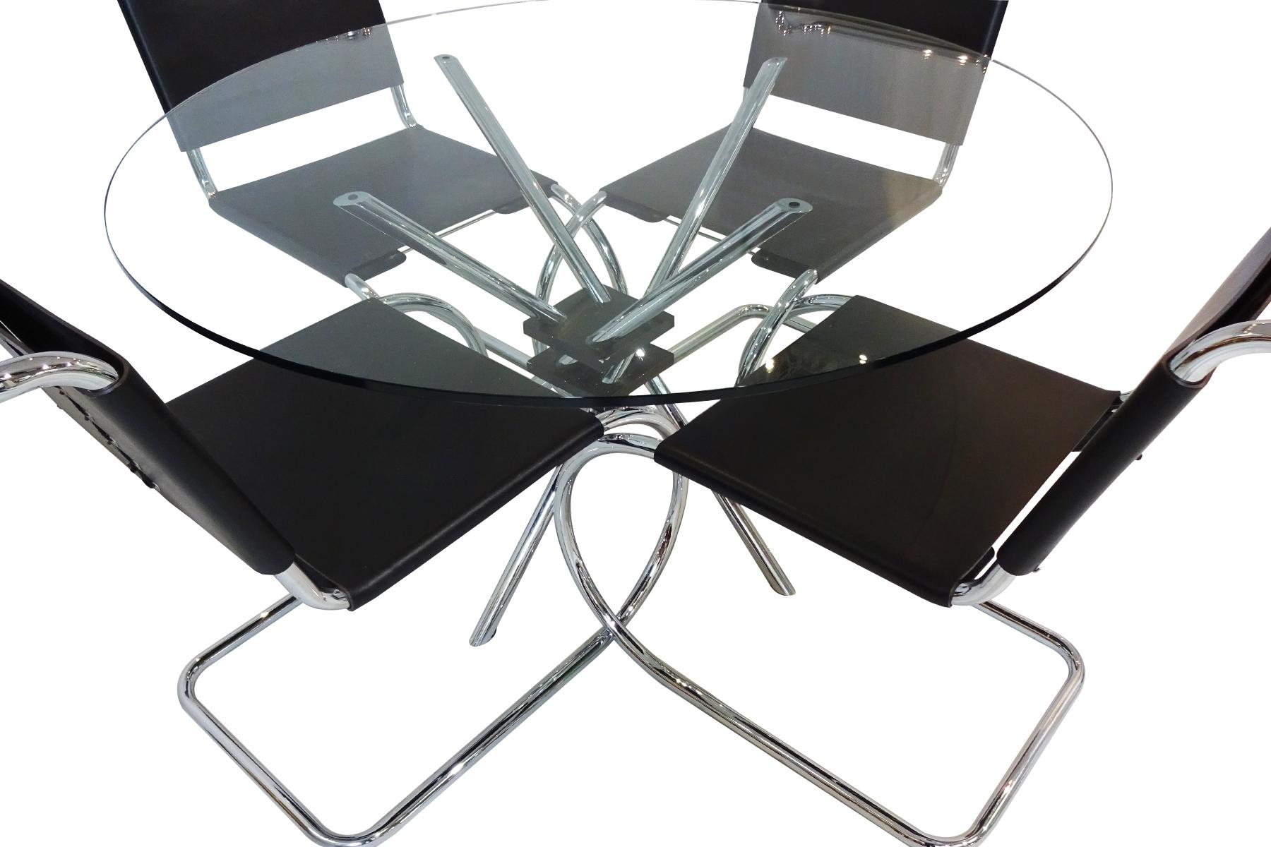 A set of Mies van der Rohe black leather and chrome chairs produced by Knoll International matched to a Takehiko Mizutani MZ59 table

These chairs are a design icon being one of the very first cantilever design chairs ever designed by van der