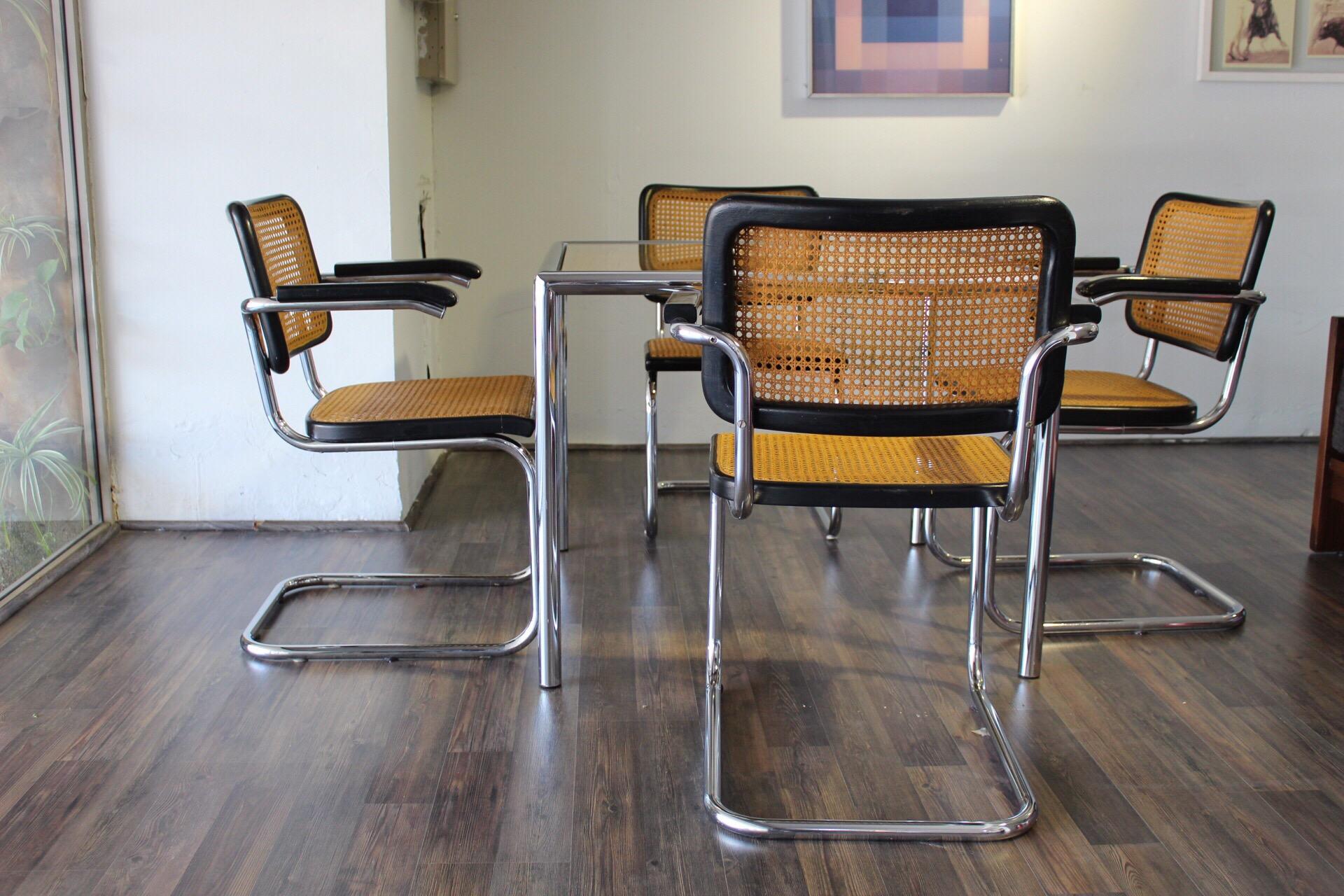 Dining Set of 4 Marcel Breuer chairs and table, tubular chrome frame, original cane seats and black lacquered wood. I bought this complete set from the original owner in Palm Springs about 20 years ago. If you need more detail of the pieces, please