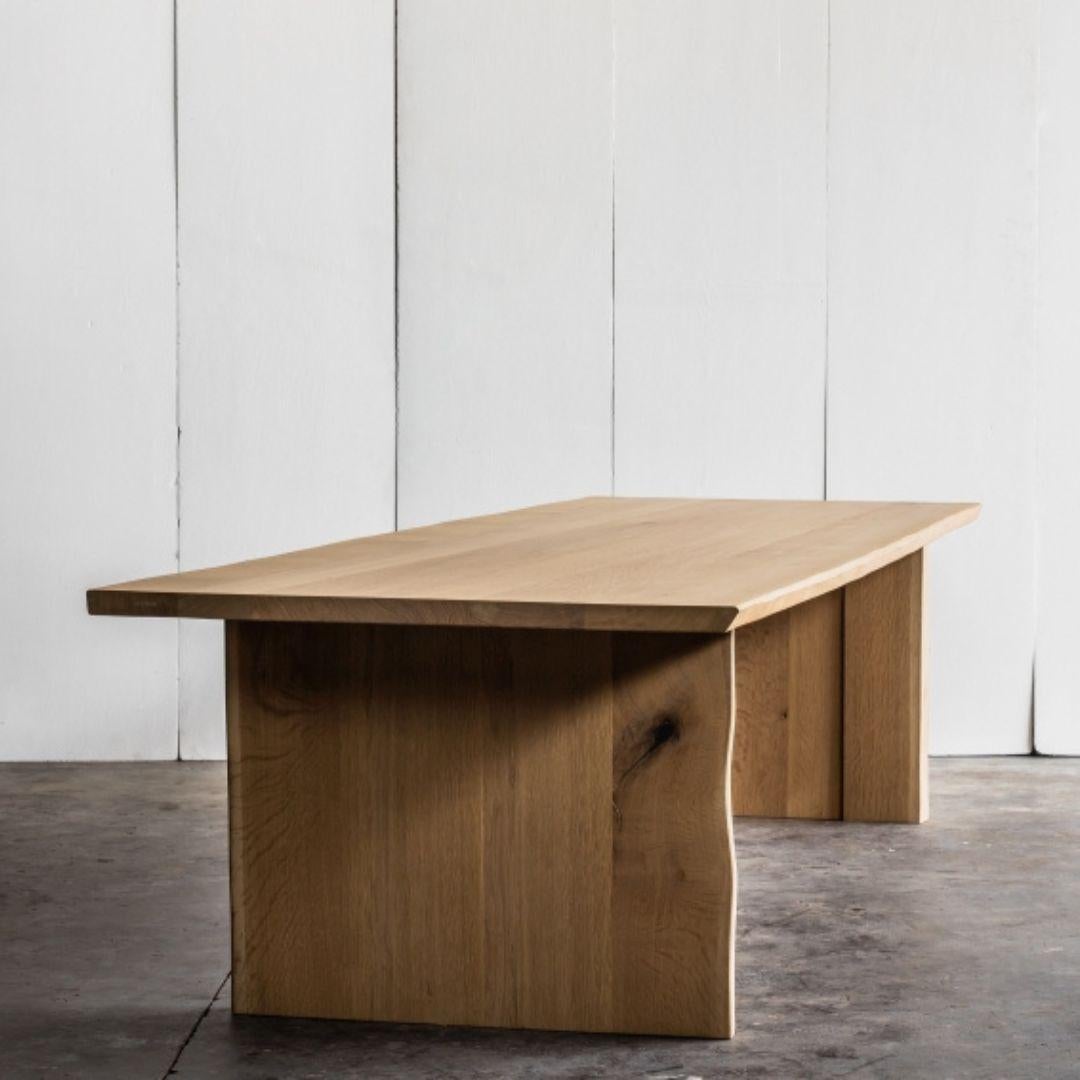 Available in oak or ebonised Oregon pine, the Altar Table is a striking fusion of minimalist precision and natural beauty. Handcrafted in Belgium by skilled artisans, this piece embodies a balance between architectural form and organic character,