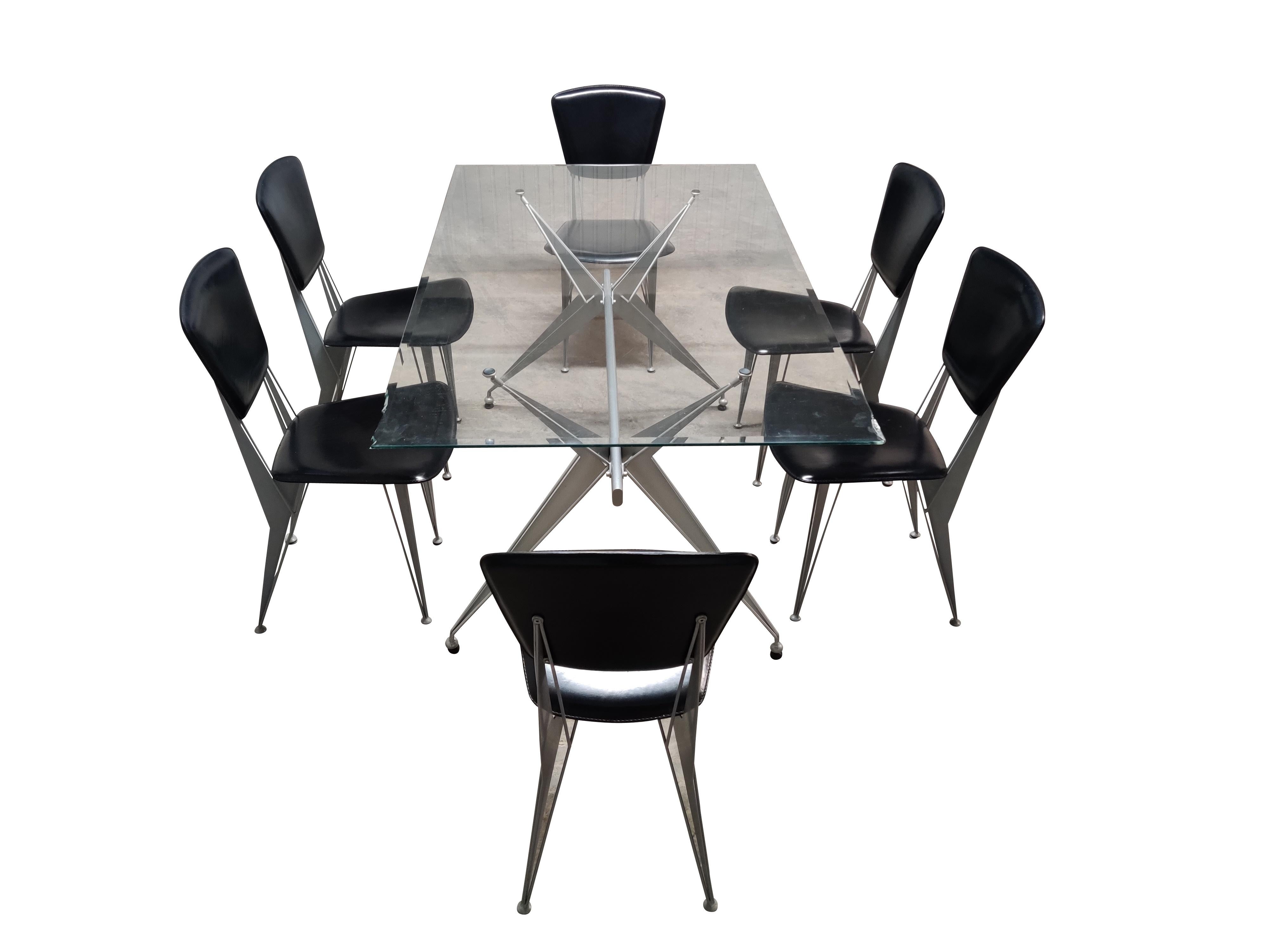Dining table and chairs made by Fasem italy.

The table has a rectangular glass top but can be changed to a custom glass if desired.

The chairs are upholstered in black leatherette.

Modern looking design set, all in good condition.

1996 -