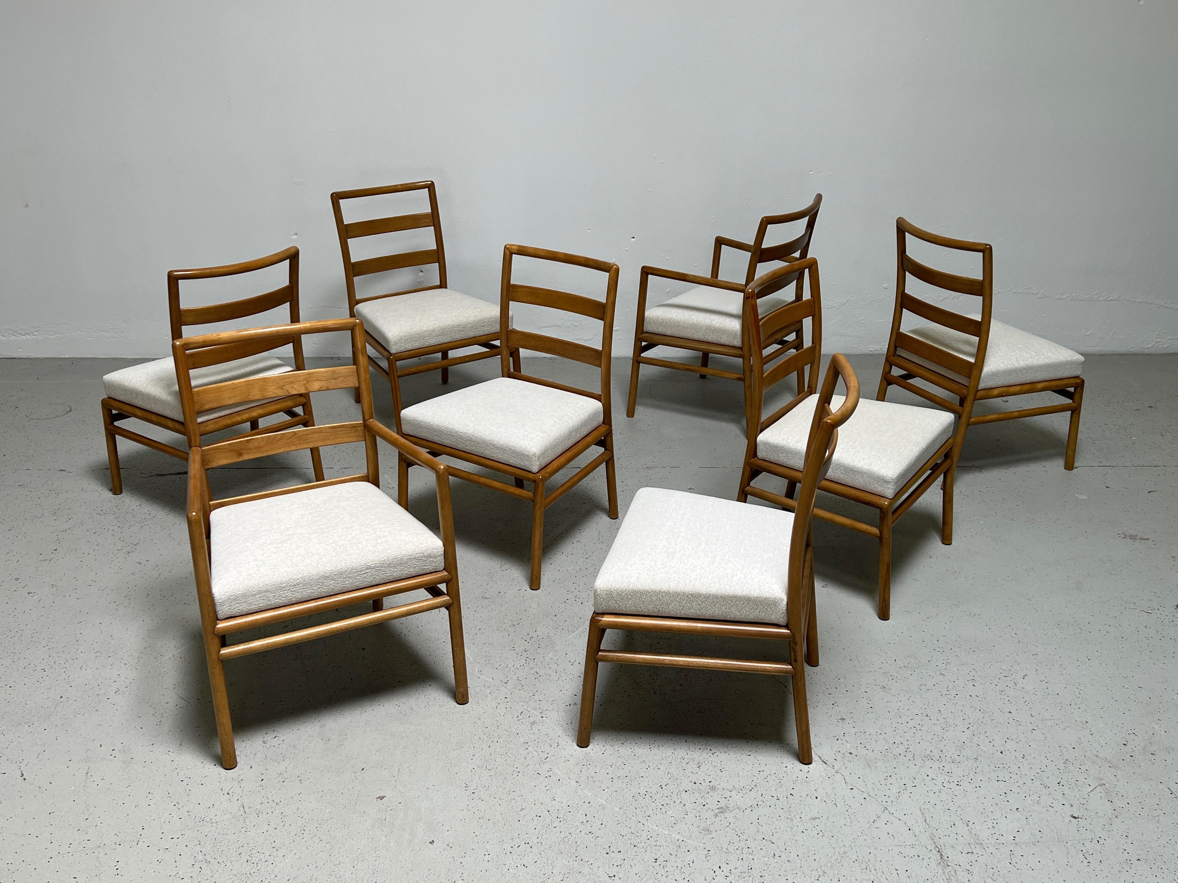 A bleached walnut dining table and eight chairs designed by 
T.H. Robsjohn-Gibbings for Widdicomb. The table measures 92