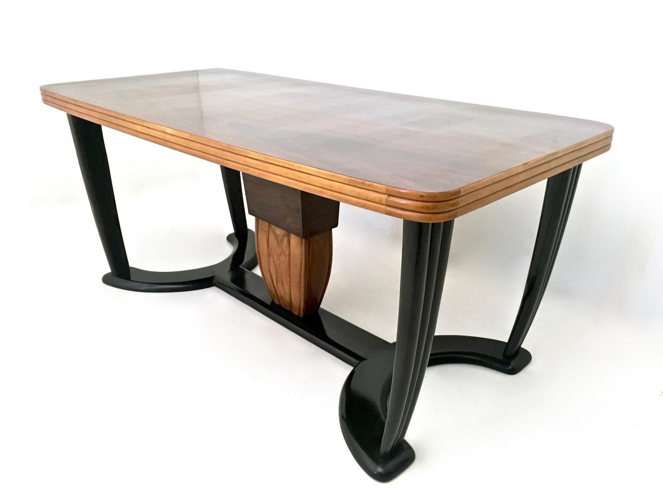 Made in Italy, 1940s.
This table is made in beech with ebonized parts and features maple edges.
It can be used with its original black opaline glass top or without it (since it is removable), as the underlying wooden top is in very good