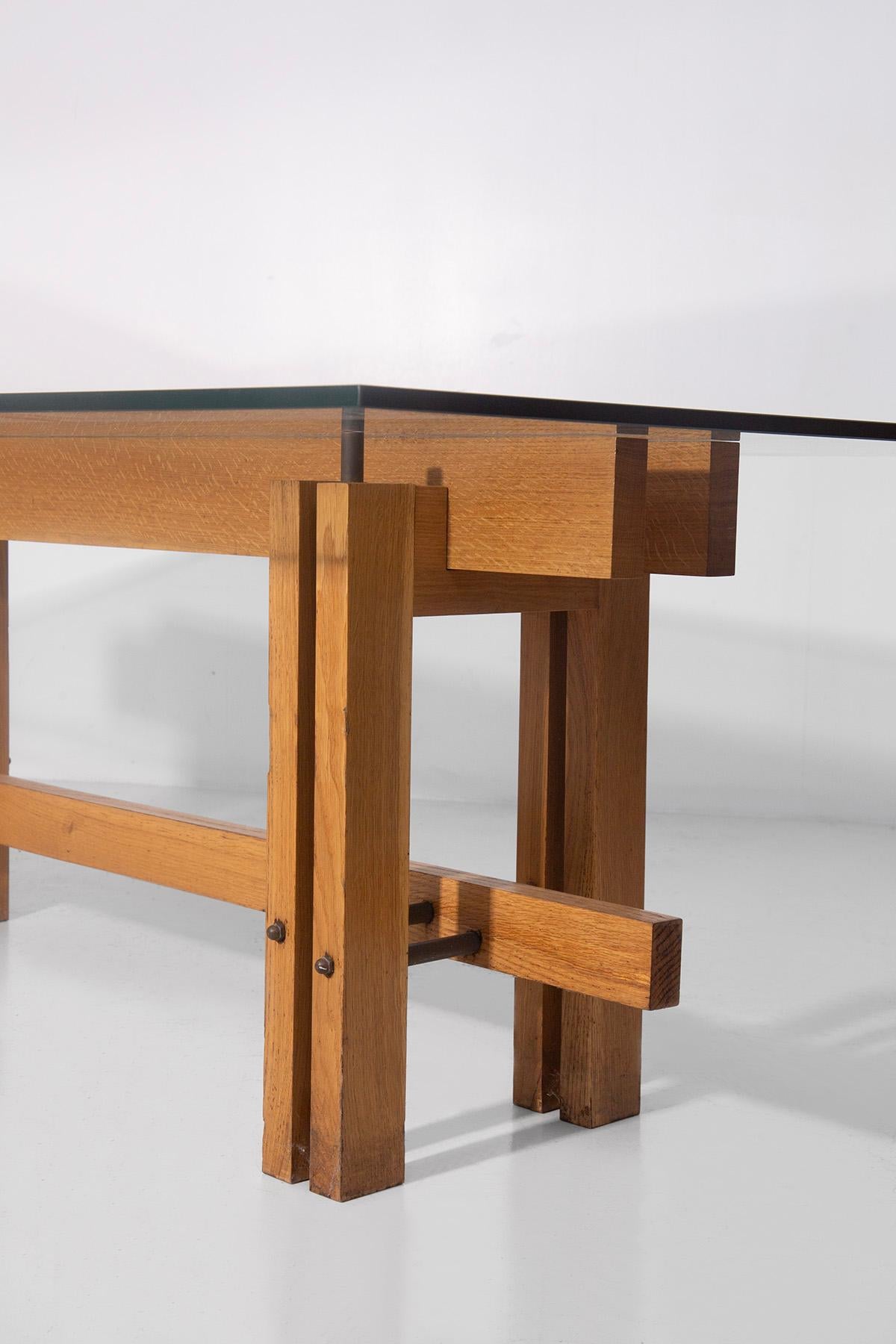 This extraordinary dining table, attributed to the visionary genius of Carlo Scarpa, is a masterpiece of 1960s-70s Italian design. Its structure, made entirely of wood, is distinguished by a rigorous and sculptural architectural language that