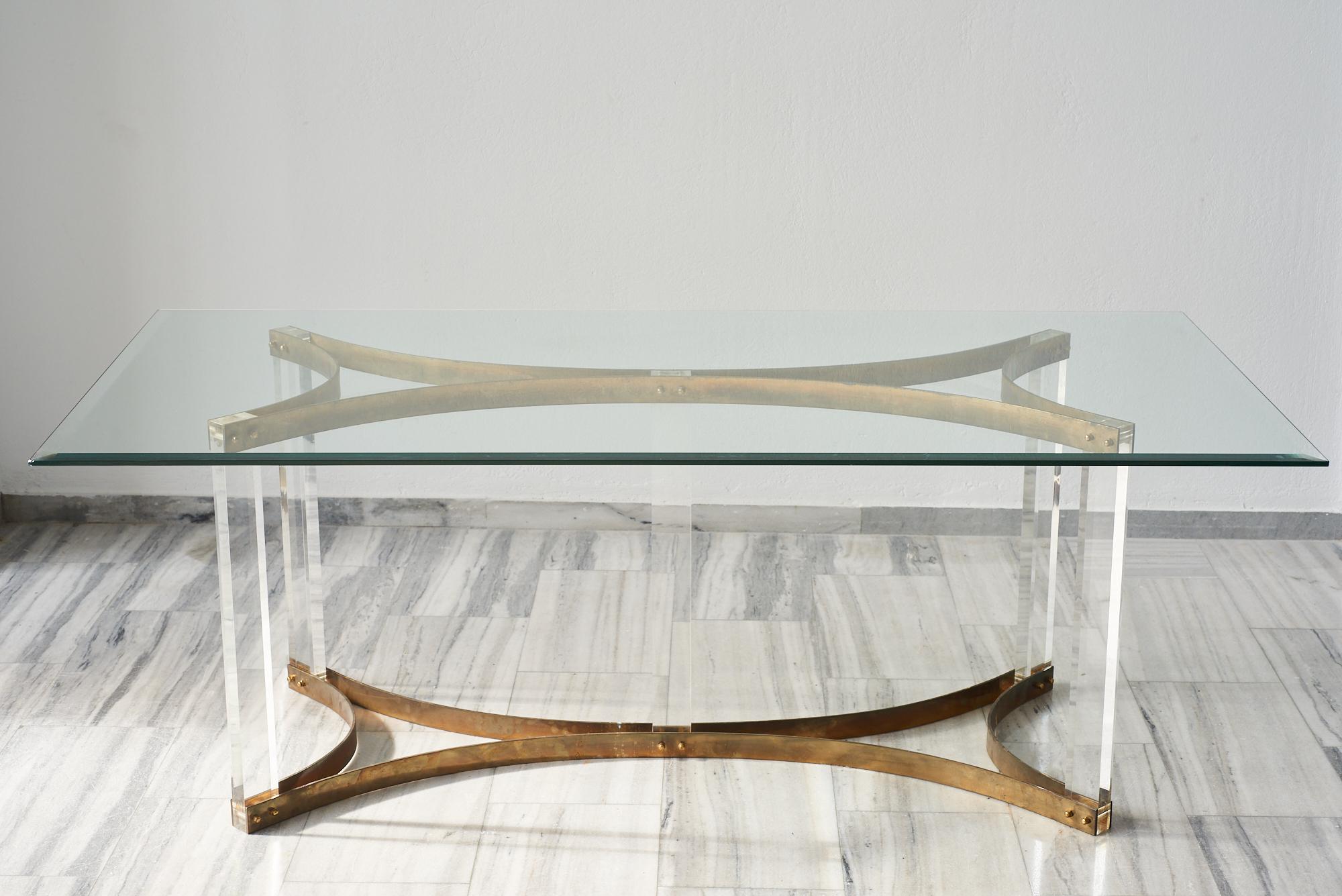 Lucite, brass and glass dining table by Alessandro Albrizzi, Italy 1970s.

Alessandro Albrizzi opened up his first of many shops all over the world in 1968 at One Sloan Square in London. When the words 