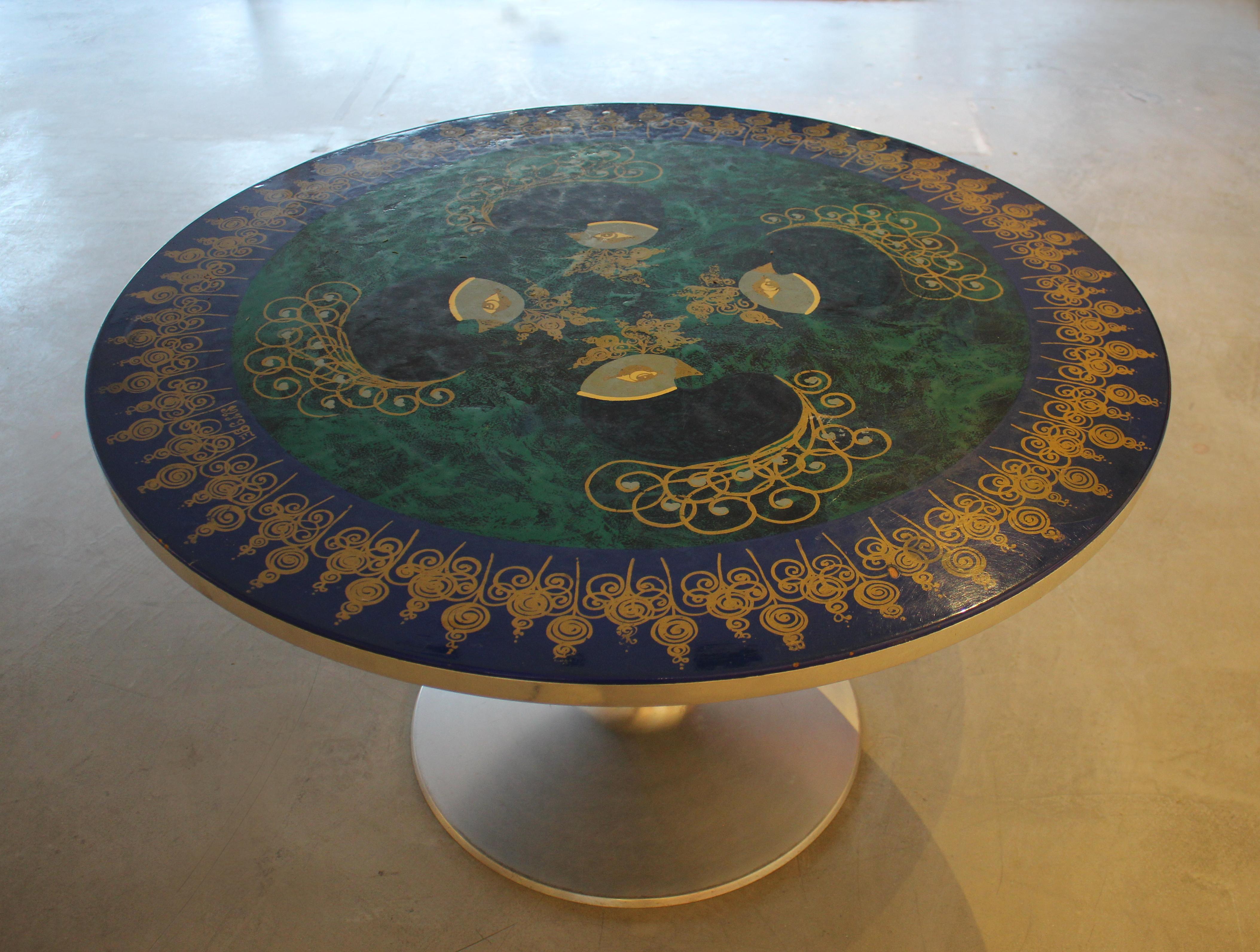 Circular tabletop with aluminum edge on aluminum base. Design by Björn Wiinblad and Poul Cadovius for France & Son, Denmark, 1960's. Painted top by Susanne Fjeldsøe Mygge. Signed: Mygge. Maker's Label. Very good condition with slight signs of wear