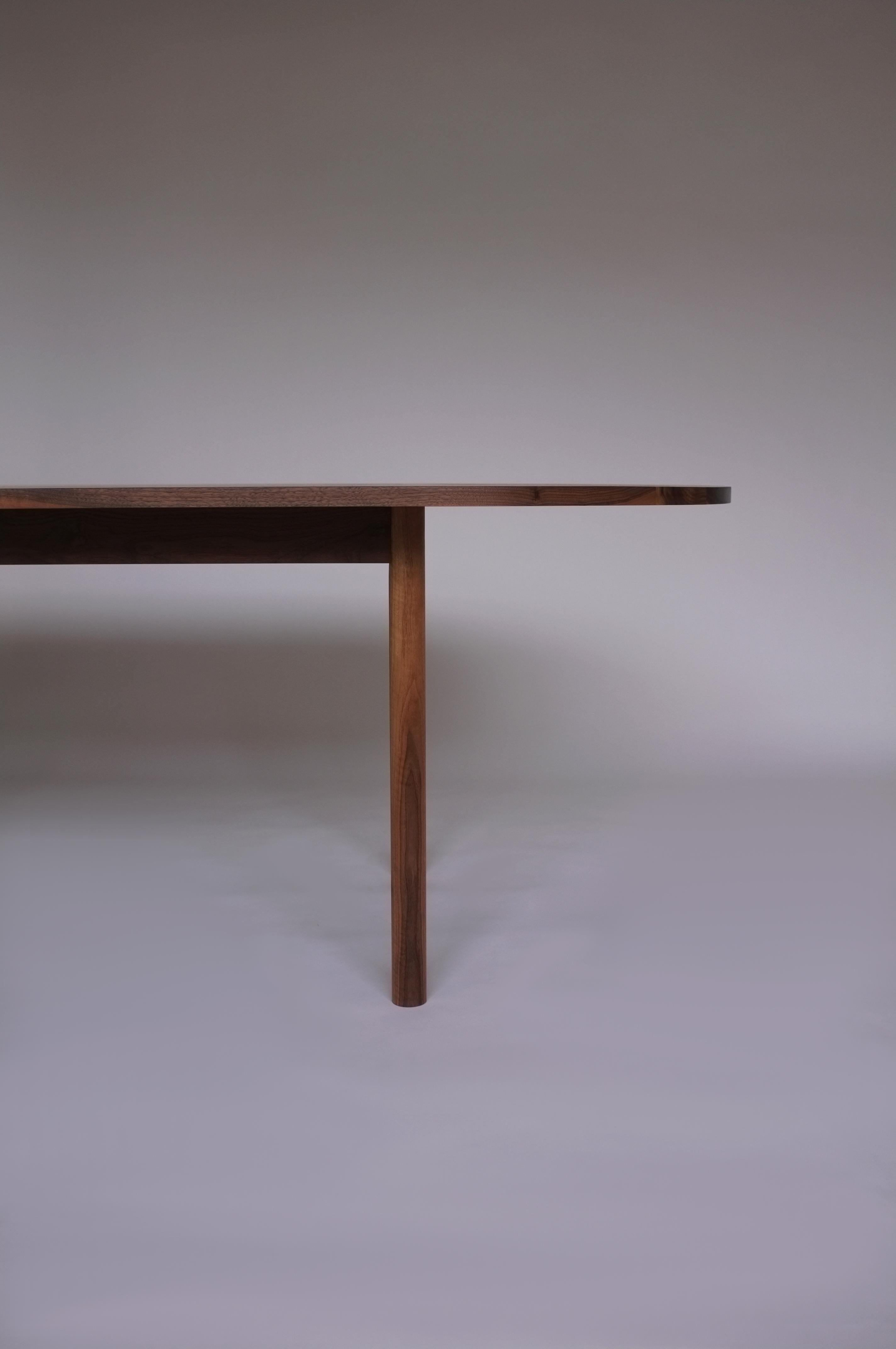 Dining table No. 1 by Campagna, shown in walnut.

Minimal and sturdy, this pill shaped dining table is both modern and classic. This table features clean lines, turned legs and solid wood joinery, ensuring it will last for generations to come.