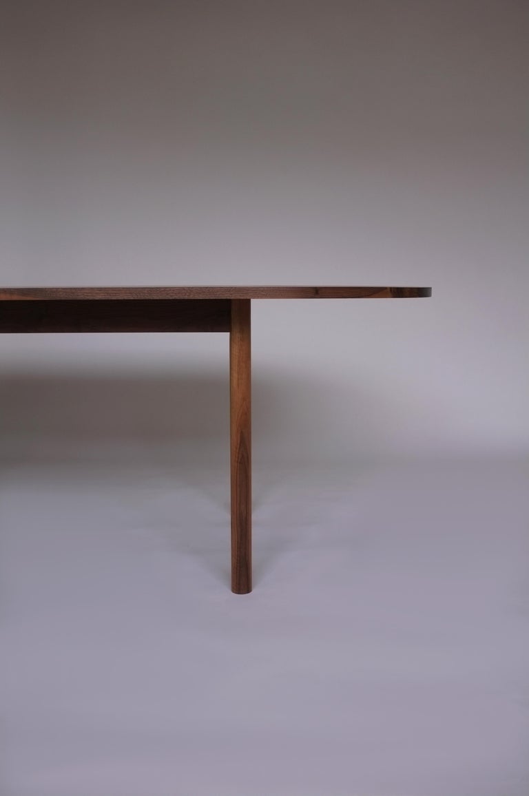 Dining table No. 1 by Campagna, shown in walnut.

Minimal and sturdy, this pill shaped dining table is both modern and classic. This table features clean lines, turned legs and solid wood joinery, ensuring it will last for generations to come.