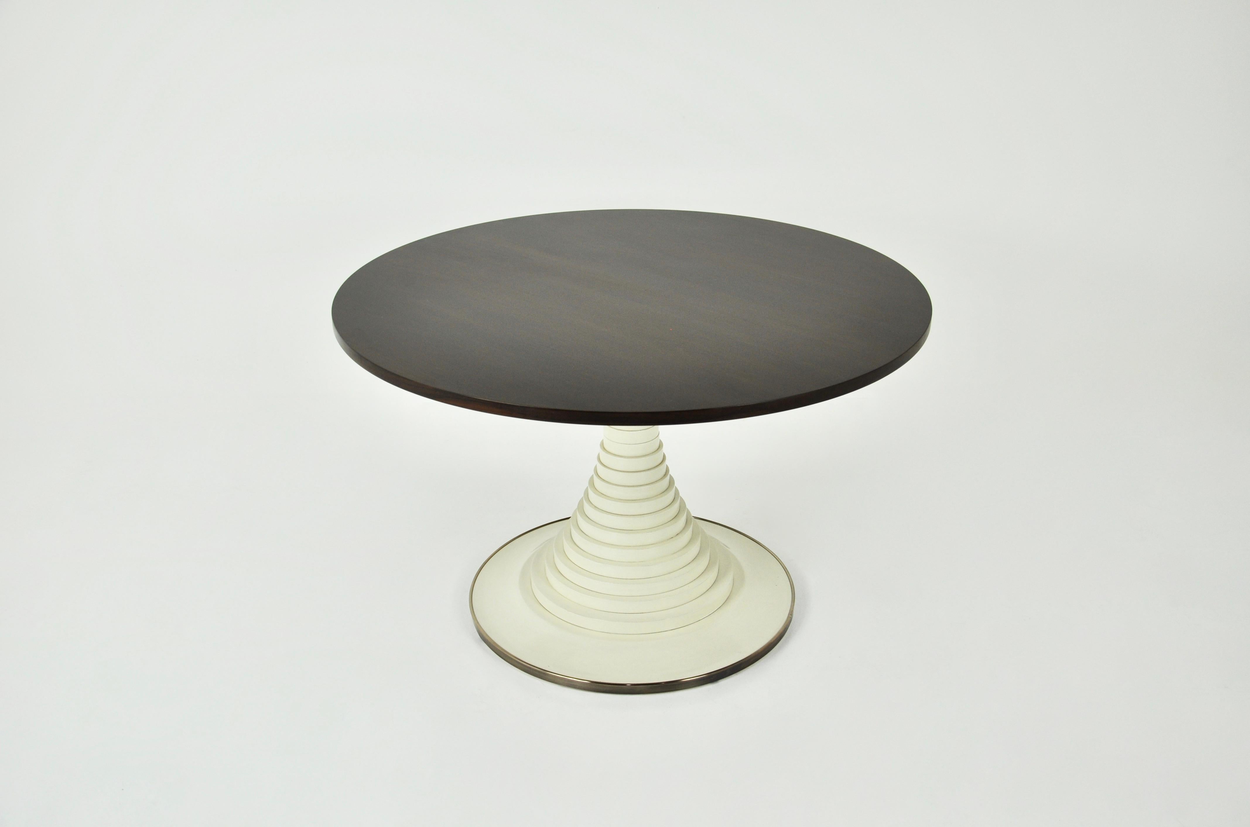 Wooden dining table. The leg of the table is made of solid wood discs, with a band of chromed brass on the lower part of the leg. Wear due to time and age of the table