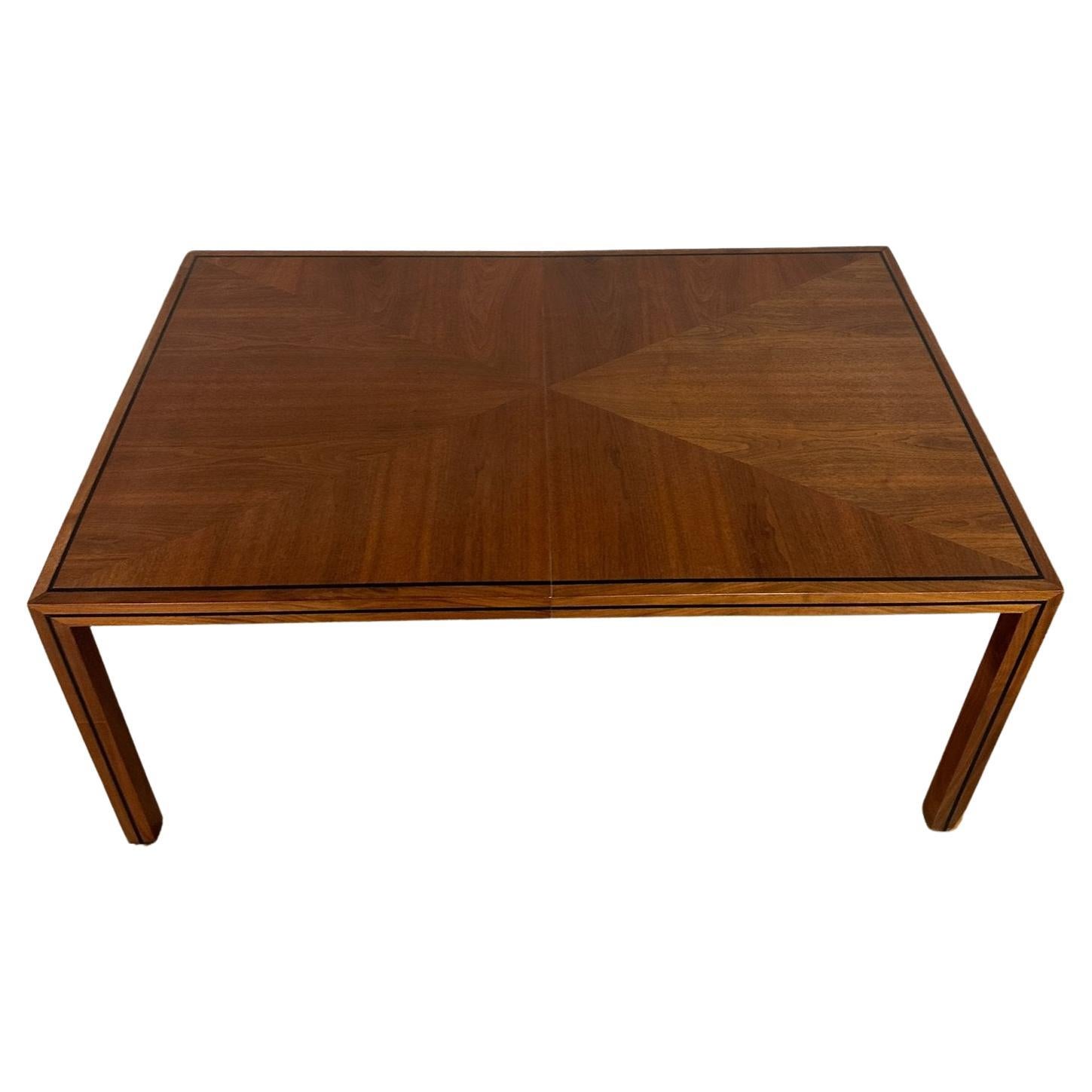 W66 W106 D41 H29 KC26.5 LEAF W20 (2)

Minimal walnut dining table by Dillingham. Item feautres a clean minimal deisgn, contrasting grain, inlaid black laminate detail, and two large extensions. Table shows well with no major areas of wear. Item is