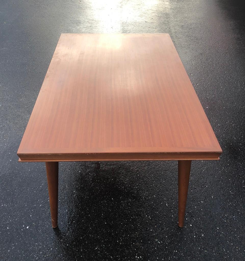 Dining table from the 1950's in original condition with built in leaves , each leaf is 50 centimeters (20