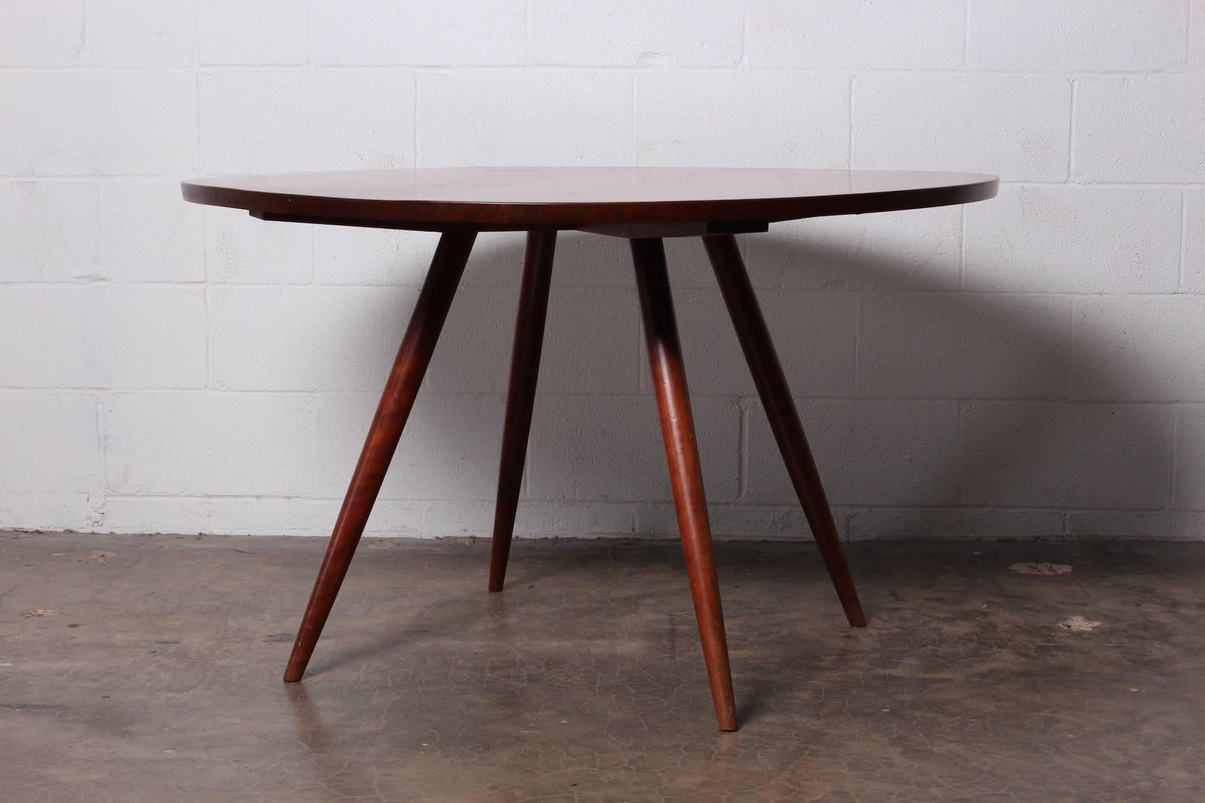 A walnut dining table with cherry legs by George Nakashima. All original with documentation from 1952.