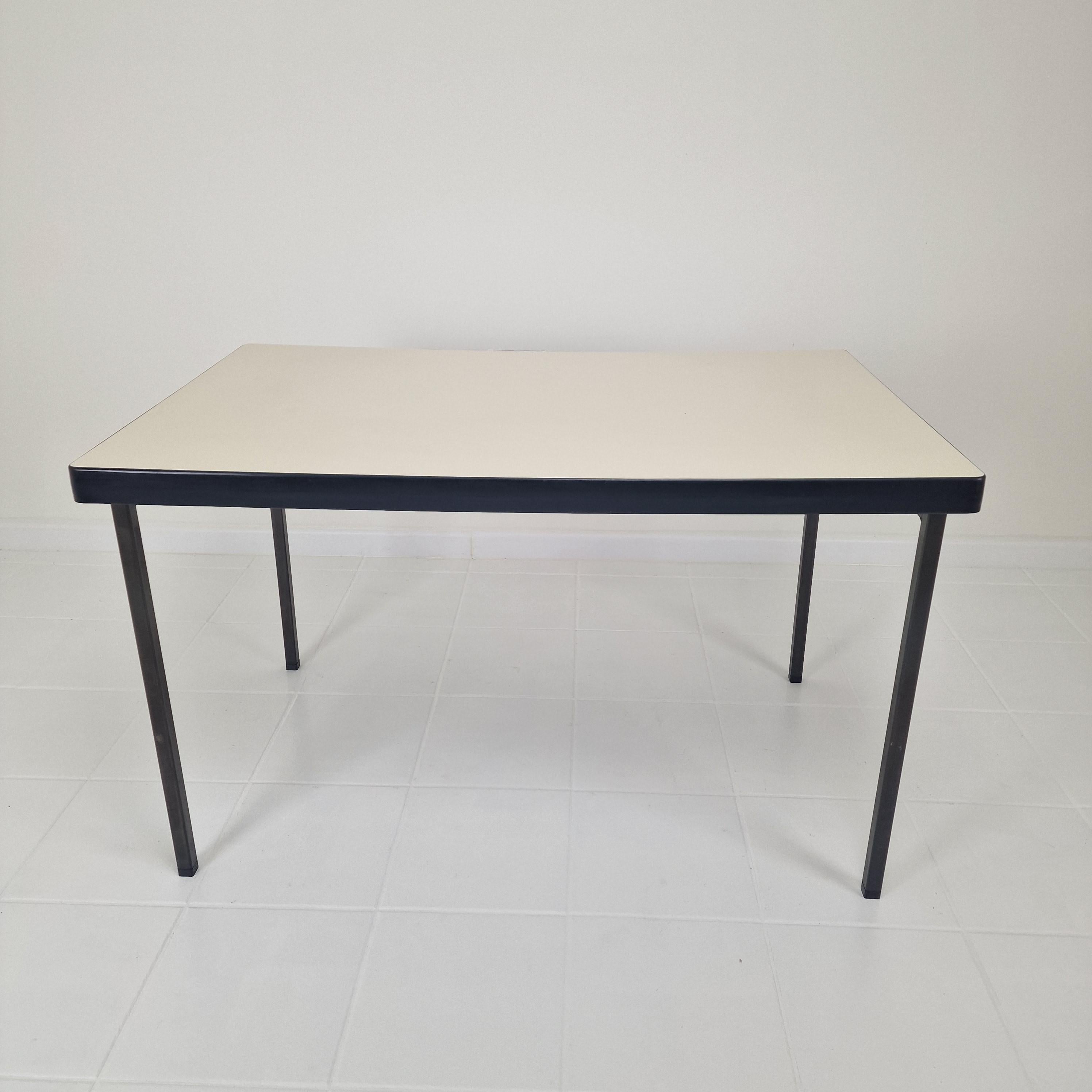 Very nice dining table designed by Hein Salomonson for AP Original (Polak), The Netherlands 1960. 

This table has 4 solid black painted steel legs and a white plated top.

The table is in good condition with the normal traces of use (see the