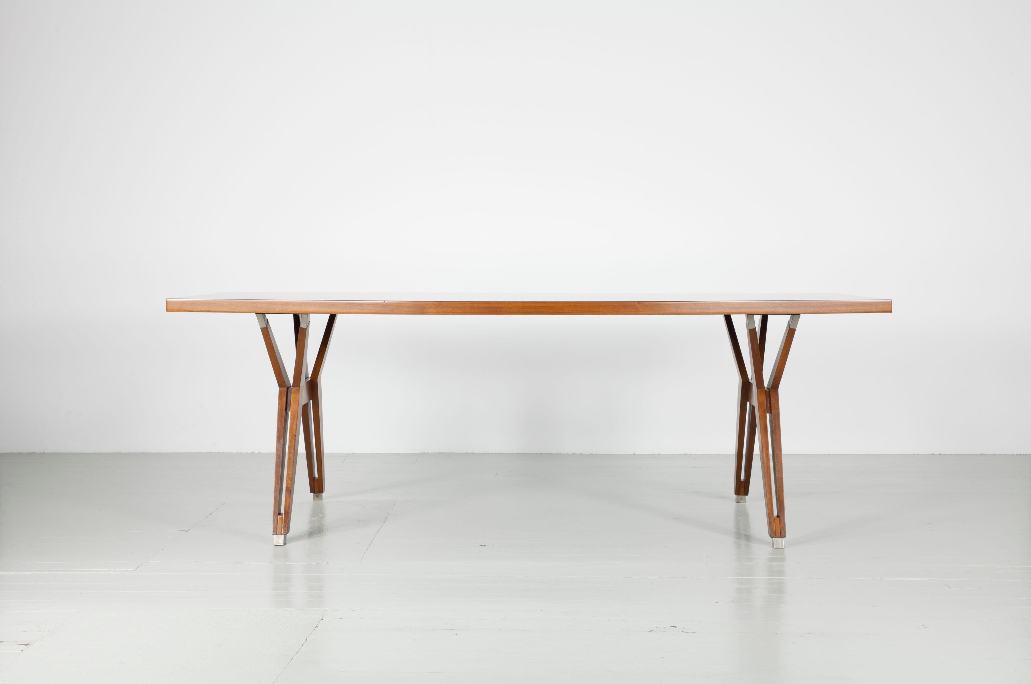 Dining table designed by Ico Parisi, made by MIM - Mobili Italiani Moderni, Roma, Italy, 1960s. Striking in this design is the boat-shaped table top. The table remains in a very good condition and is marked with the MIM signature at the side.

Feel