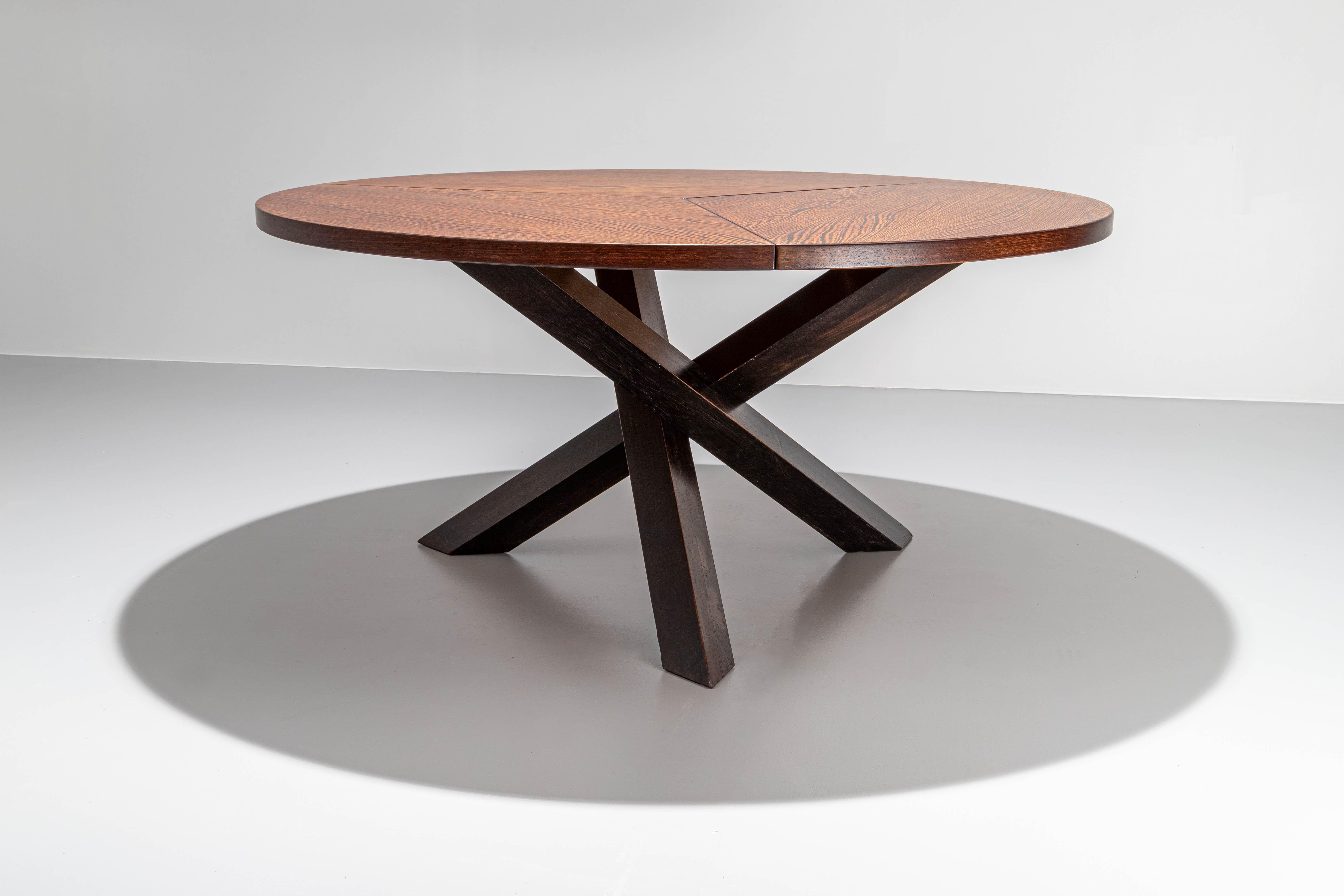 Fully restored and newly lacquered tripod dining table by Martin Visser in wengé hardwood.

What stands out is the grain of the wood. Very expressive and discriminate flames of black and dark brown make this large geometrical dining table a