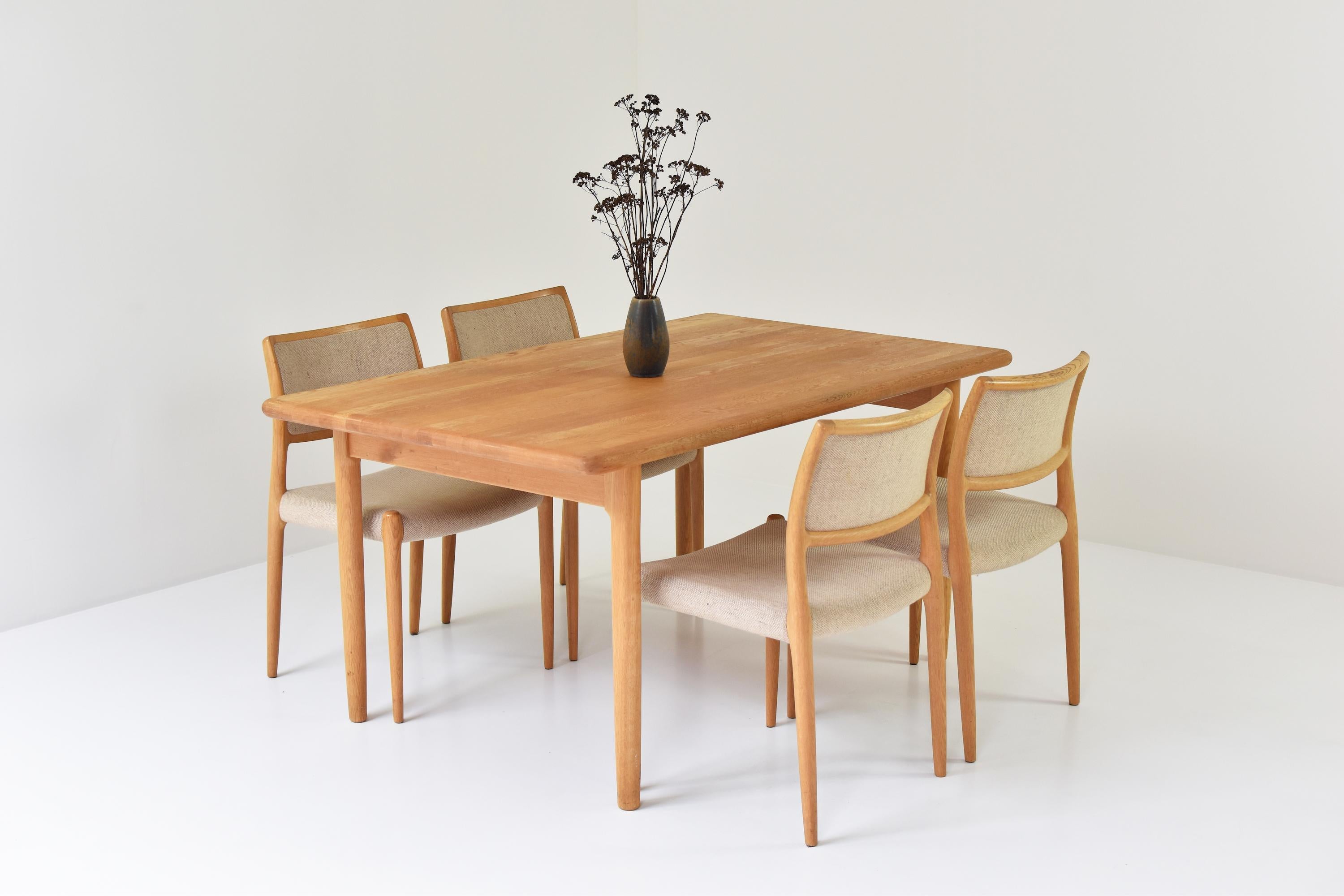 Dining table by Niels Otto Møller for J.L. Møller Møbelfabrik, Denmark 1954. Made out of solid oak and in good original condition. Labeled underneath. The set of 4 matching dining chairs are sold. 

Measurements
H 75 x W 150 x D 90 cm.