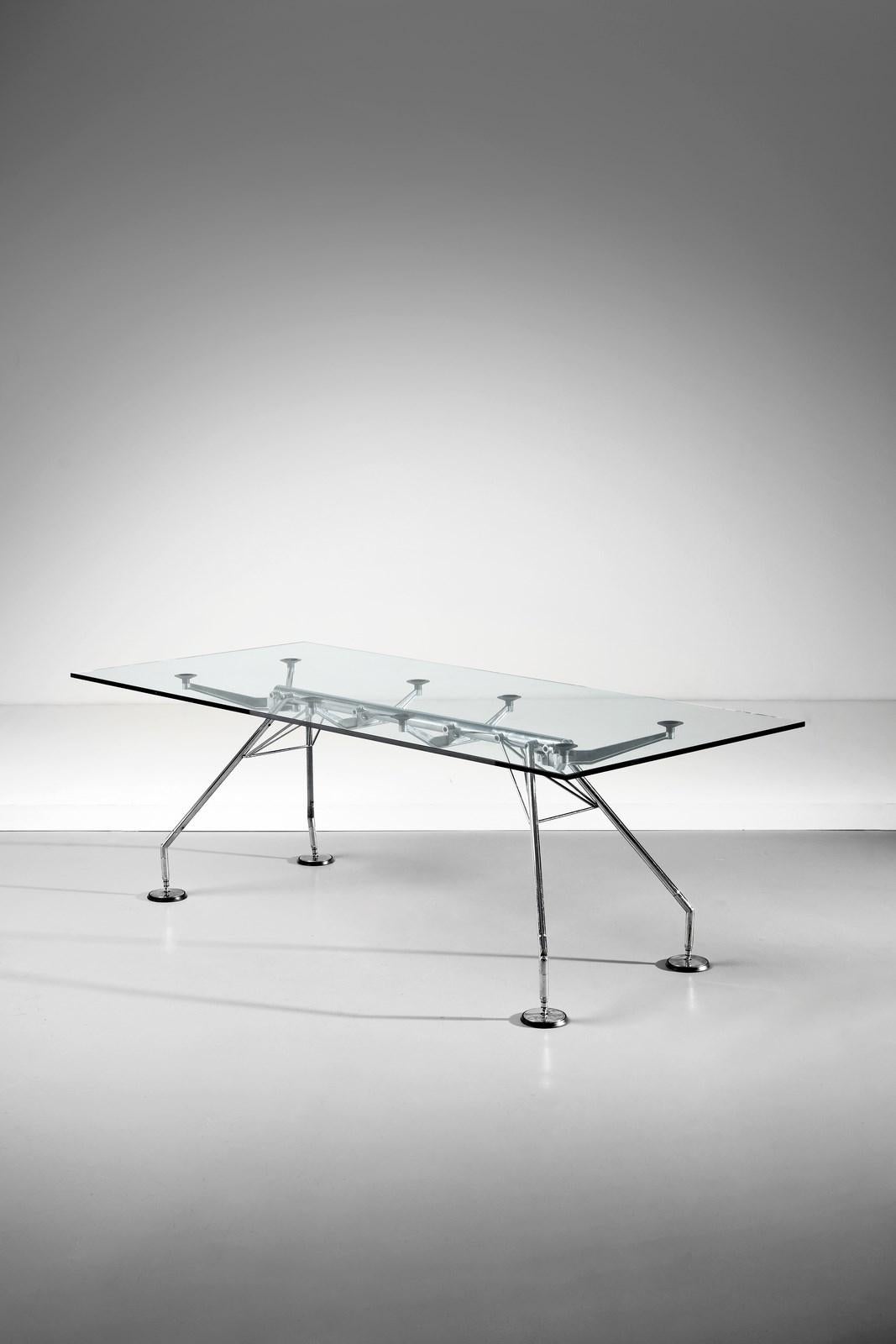 The Norman Foster-designed table for Tecno is a striking embodiment of sleek, modern elegance combined with functional efficiency. This innovative piece of furniture represents a harmonious fusion of form and function, reflecting Foster's signature