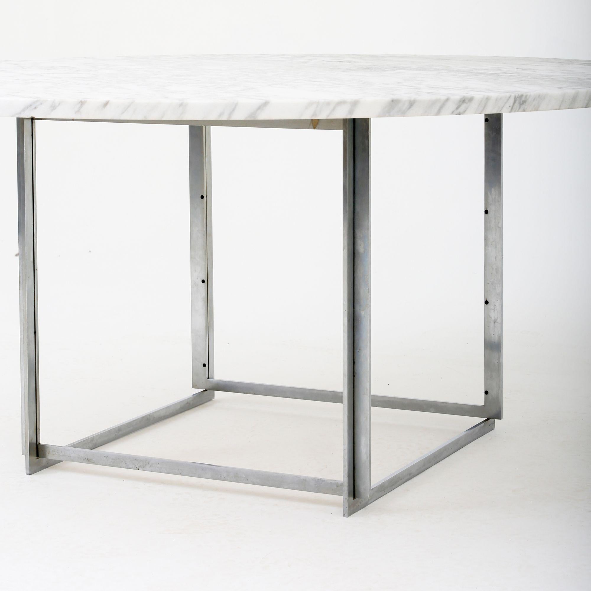 PK 54 - Round dining table with chromed steel frame and light flint-rolled marble top. Poul Kjærholm / E. Kold Christensen.